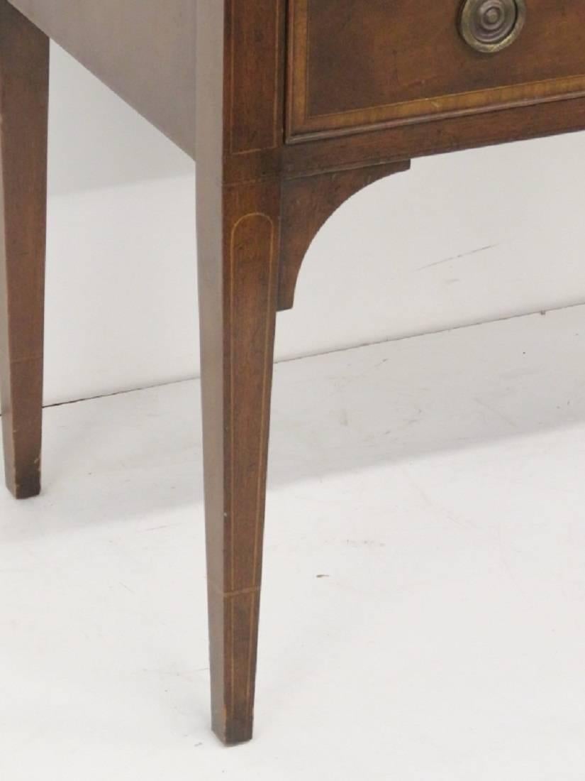 Mahogany with inlay. Tambour doors and flip-top that open for desk. Bookcase top. Metal eagle and finials on top.