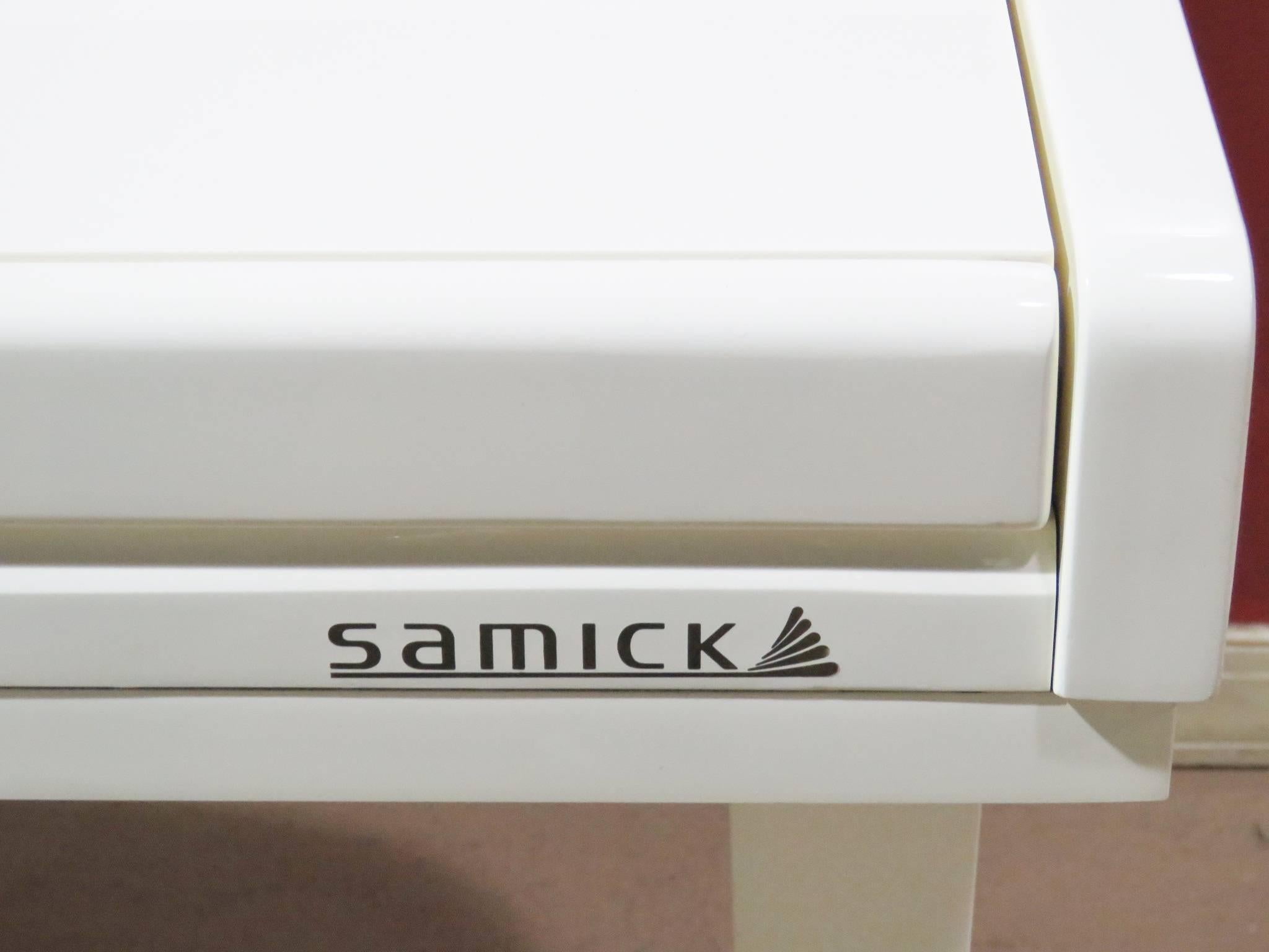 Samick SXP-501 digital piano with matching piano bench. White lacquer finish. Serial number 95100314. Manual included.