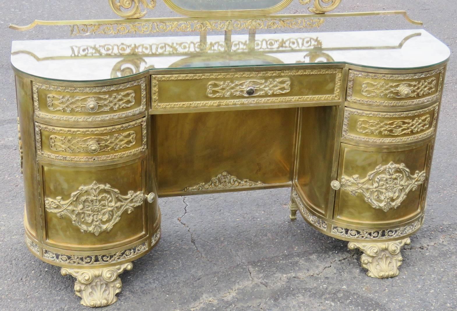 Églomiséd mirrored top. Metal decorated vanity and mirror. Beveled glass mirror.
