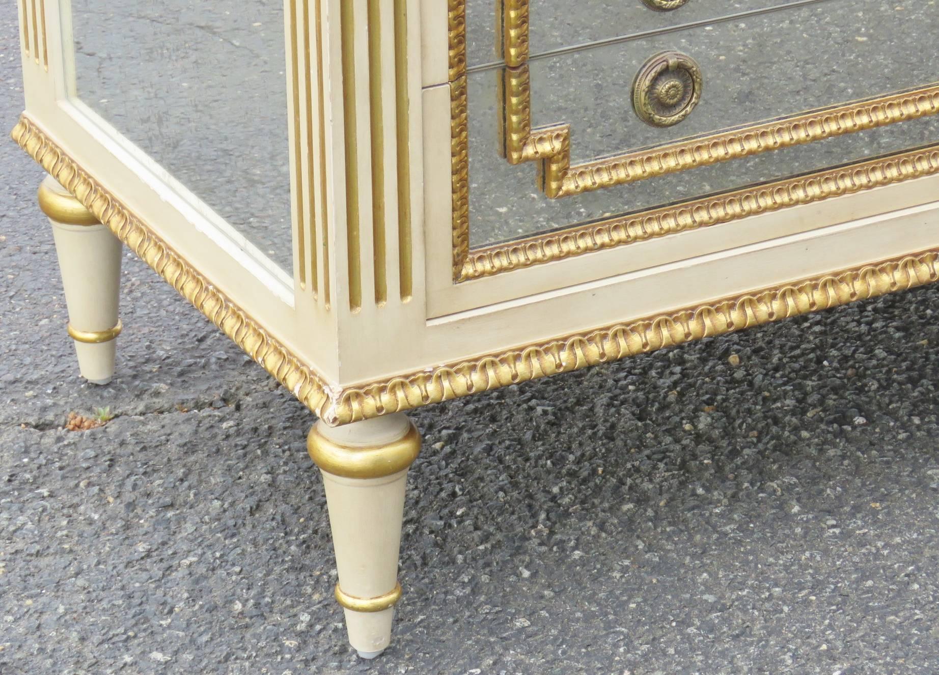 Pair of Louis XV style carved cream and gilt frames with mirrored panels and slate tops.