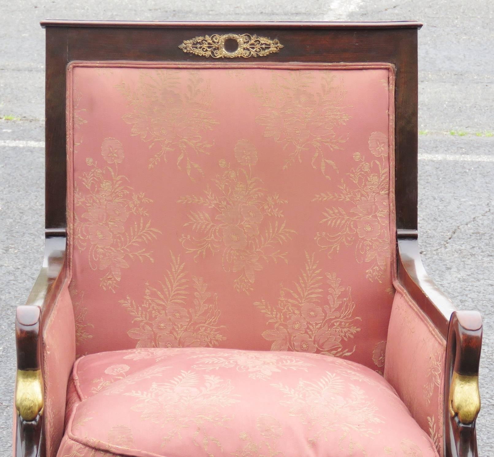 Gilt painted swans heads. Pink damask upholstery. Metal mounts and claw feet.