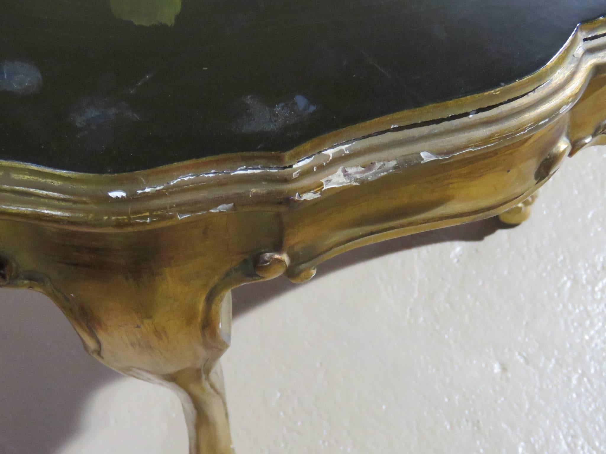 Silver gilt carved base with floral paint decorated top.
