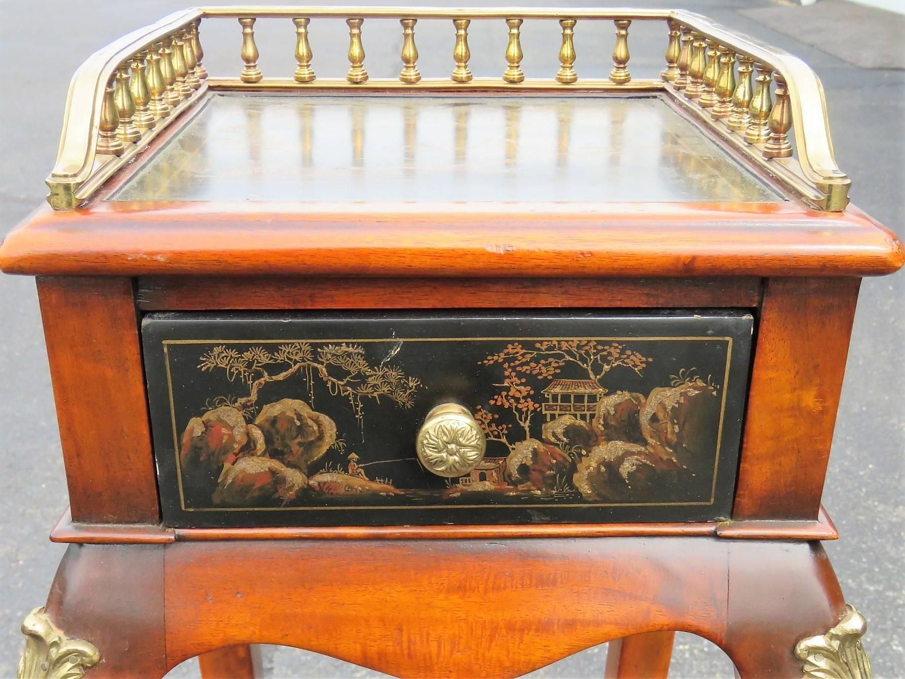 Chinoiserie decoration. Brass galleries and mounts.
