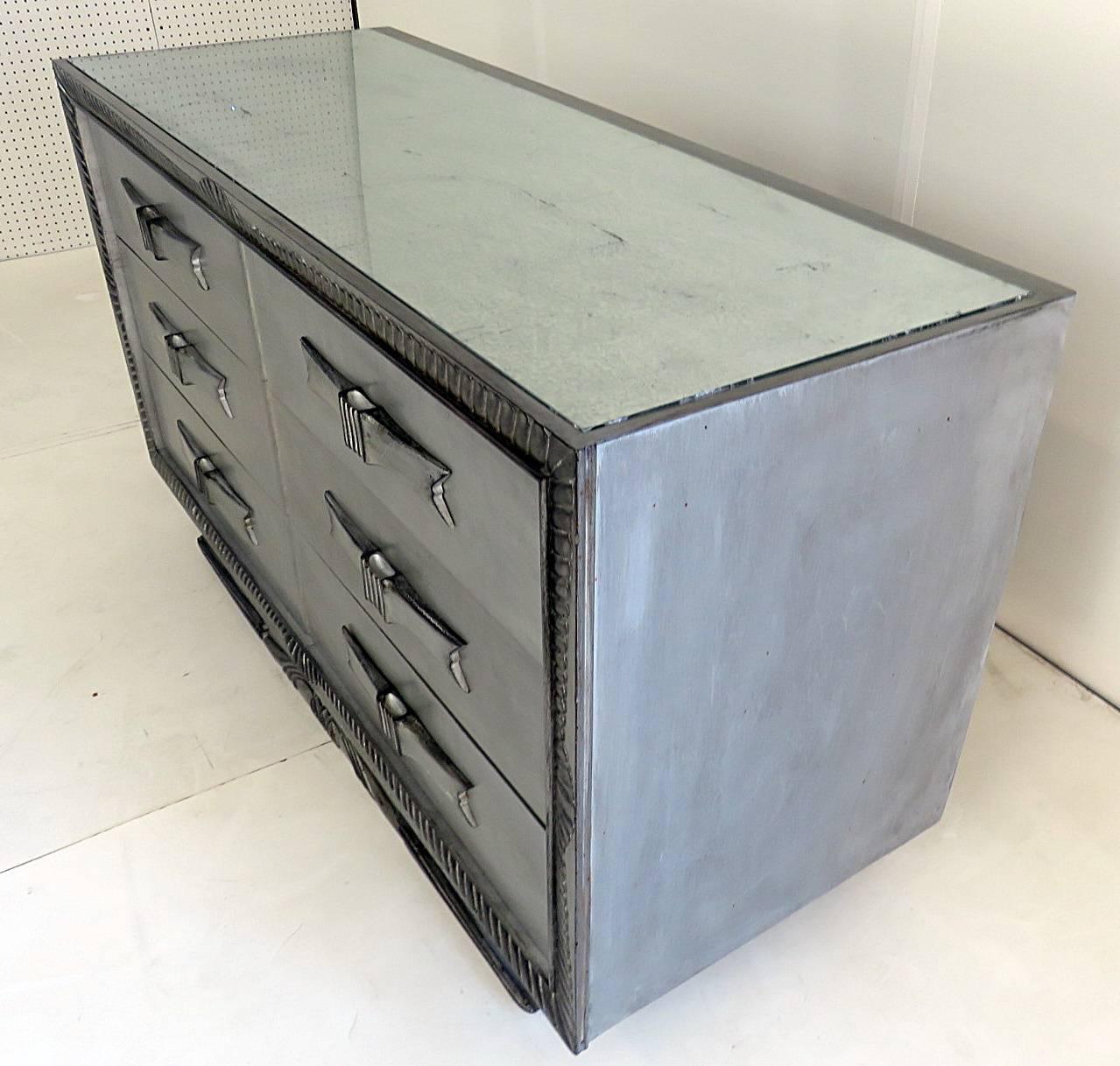 Silver distressed frame with a mirrored top and six drawers.