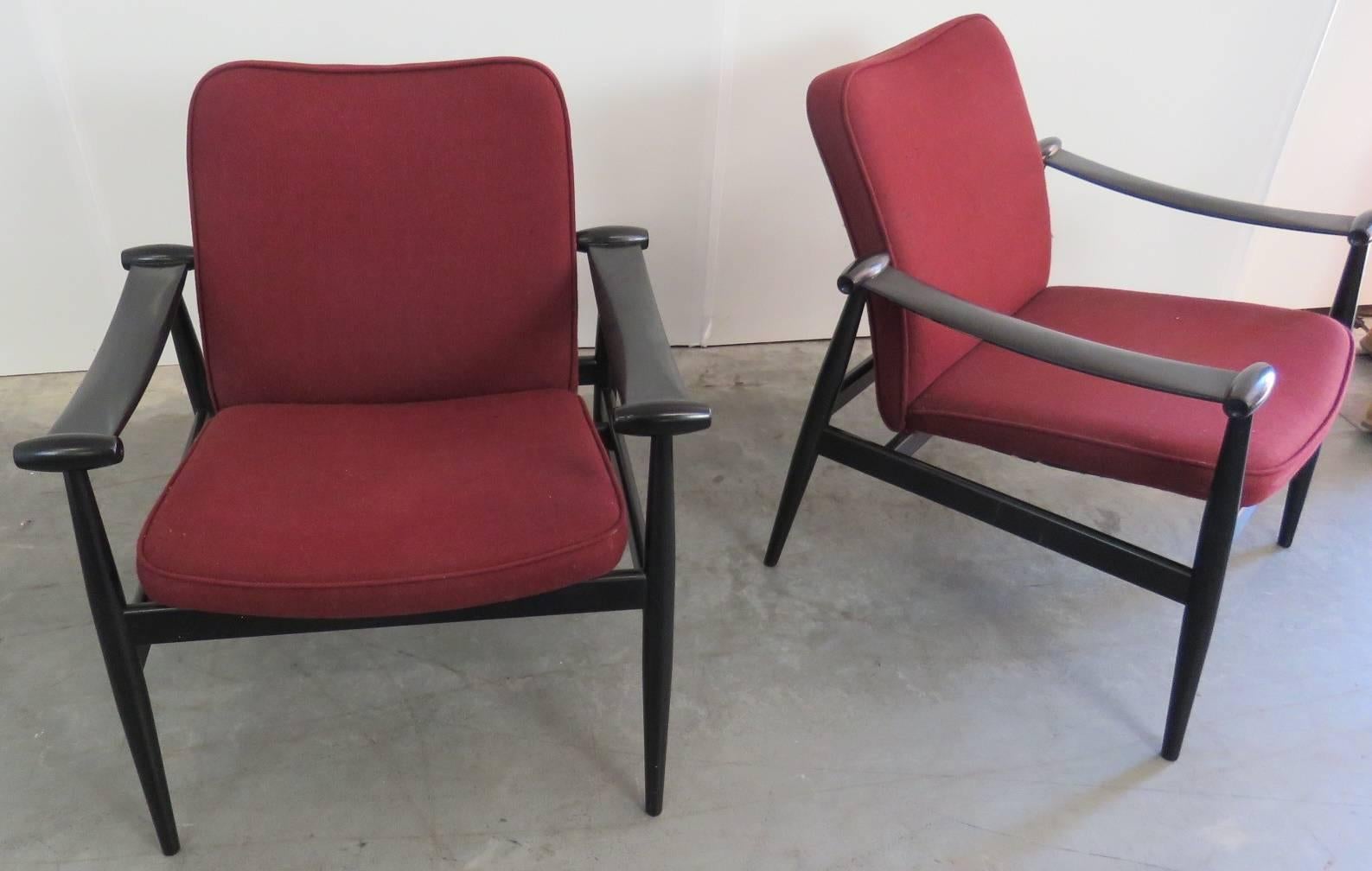 Pair of Finn Juhl ebonized armchairs. Measures: 17