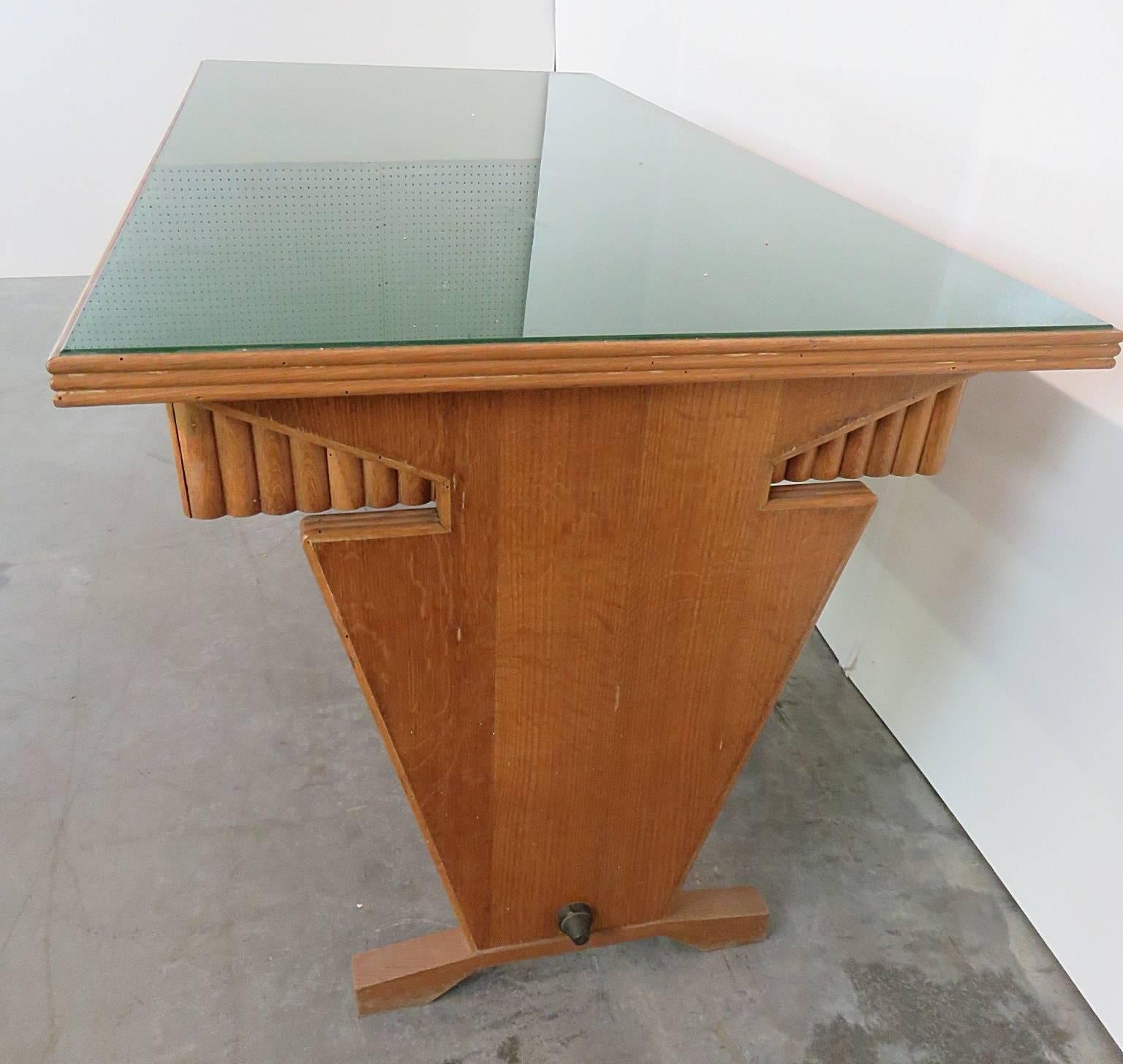 Gio Ponti style desk with three drawers and a glass top.
