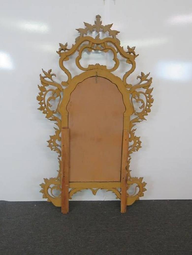 Venetian carved and distressed painted mirror.