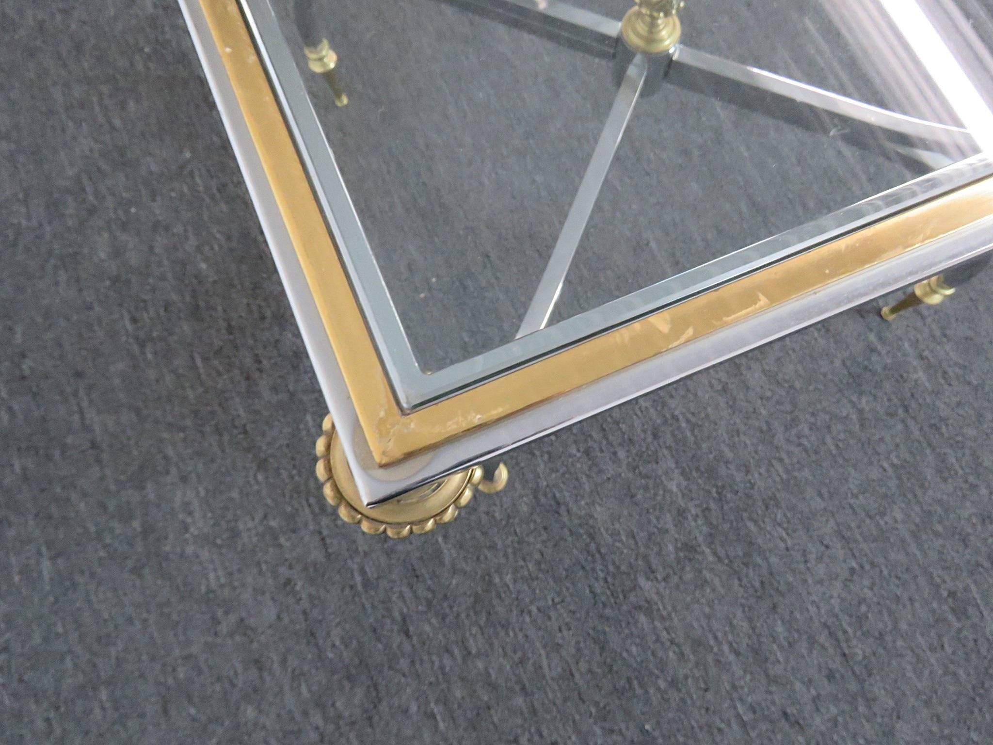 Pair of Jansen style steel and brass glass top end tables.