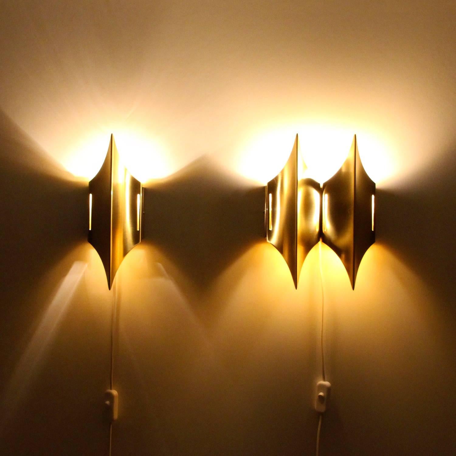 Gothic 1 + 2 wall lights by unspecified designer for Lyfa in the 1970s - gorgeous set of two brass wall lamps in near excellent vintage condition.

Truly magnificent set of sconces comprised of elegant pointy brass shades on square brass wall