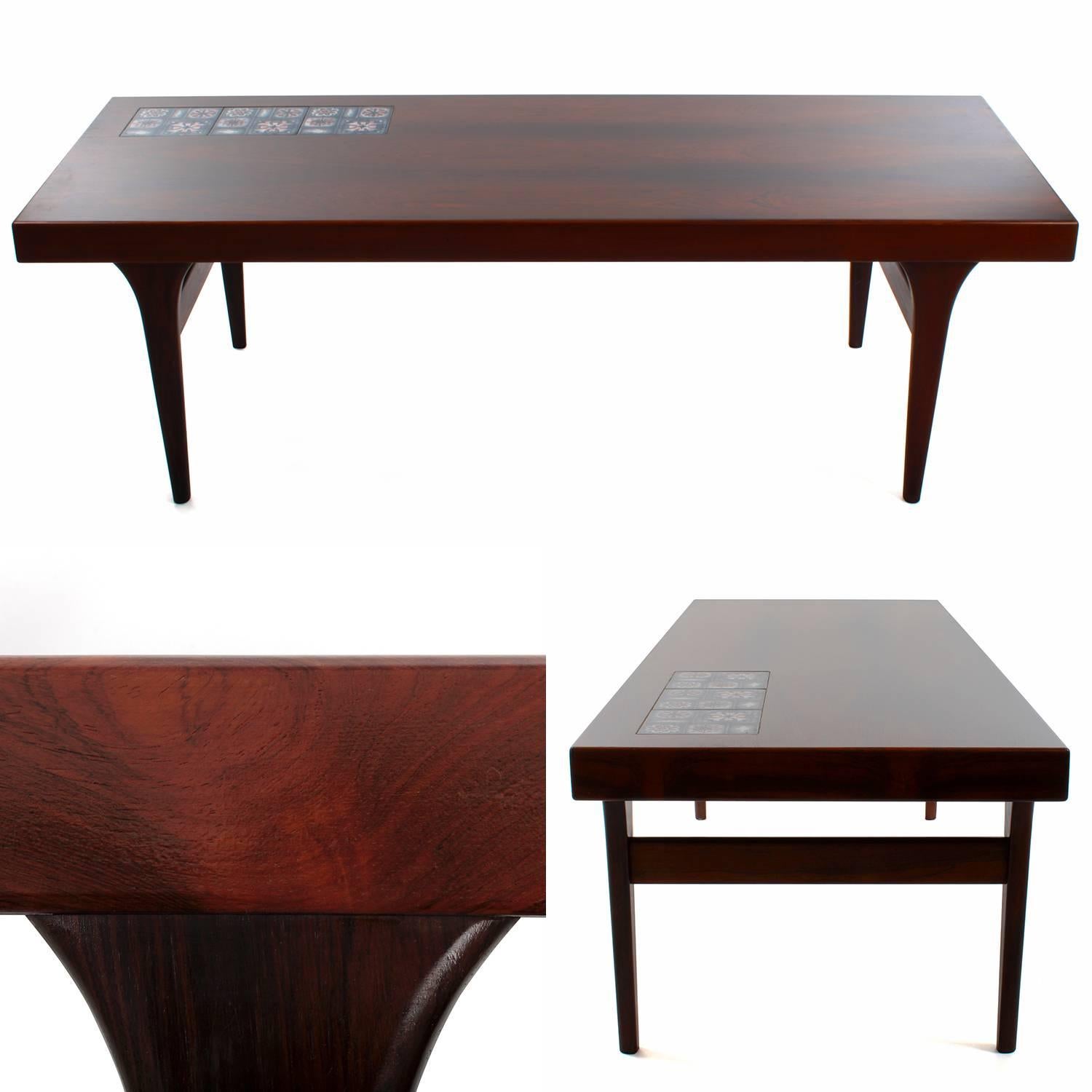 Rosewood coffee table by Johannes Andersen for CFC Silkeborg in the 1960s - gorgeous coffee table with Royal Copenhagen tiles, in very good vintage condition.

An exquisite midcentury piece, crafted in rosewood, rich in color and showing the