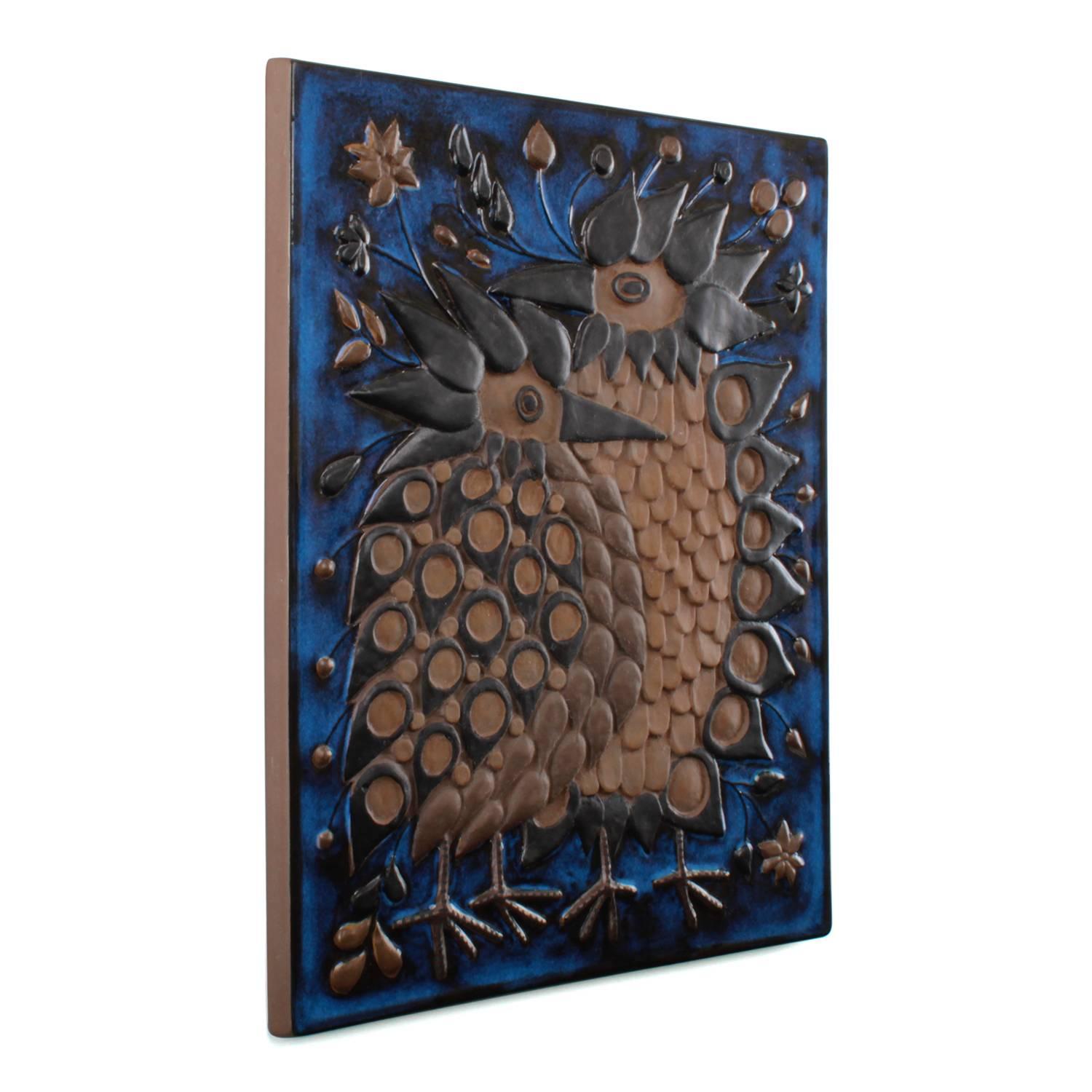 Wall Relief (no. 2866) - by Beth Breyen in the 1960s, produced by Aluminia/Royal Copenhagen - charming wall piece with two birds.

A stunning wall piece - made in terracotta with blue glaze. Featuring two birds with fuzzy feathers, one smaller