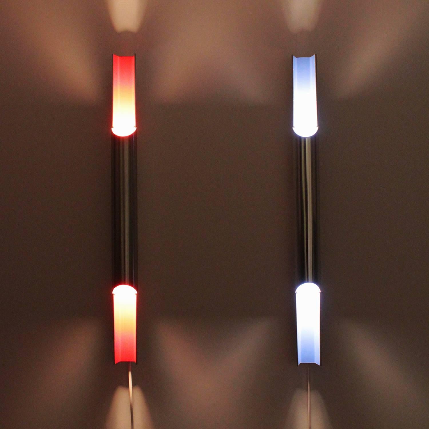 PAN-OPTICON - a fantastic pair of sconces, designed by Bent Karlby in 1968-1969 and produced by Lyfa.

A set of two polished narrow aluminum "PAN flute" pipes with a rounded polished aluminum cover and a matte inner coating one with blue