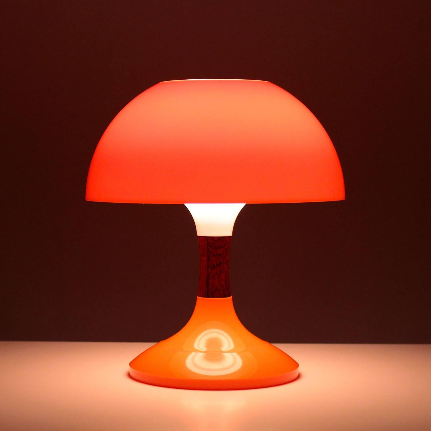 Karina table lamp by Bent Karlby for ASK Belysning in 1971, Super cute and rare table lamp in acrylic and rosewood.

A space-age table lamp with a trumpet shaped base cast in bright orange acrylic, a rosewood middle piece and a bright orange