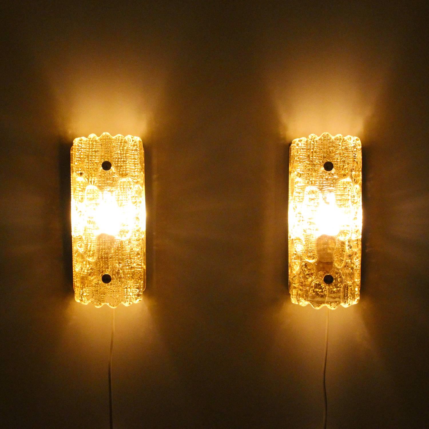 Gefion sconces (pair), pair of champagne colored crystal glass with brass wall lights by Lyfa in cooperation with Swedish glass-works, Orrefors in the 1960s. Beautiful Scandinavian Modern crystal glass wall lamps in very good vintage