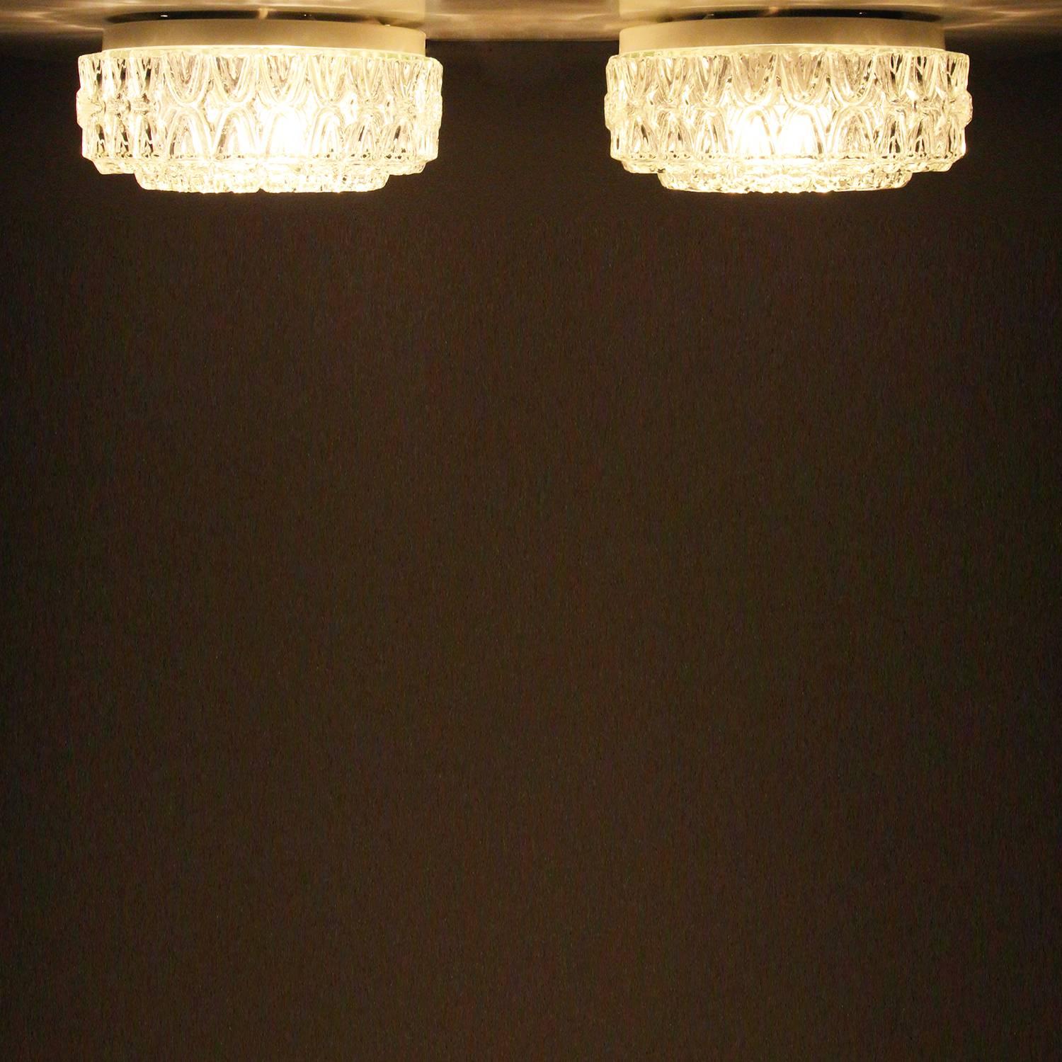 Pressed Glass flush ceiling lights 'pair' by unknown Danish producer, 1960s, beautiful pair of vintage pressed glass flush lights or wall lights with white mounting boxes in very good vintage condition.

Two charming ceiling flush lights, each