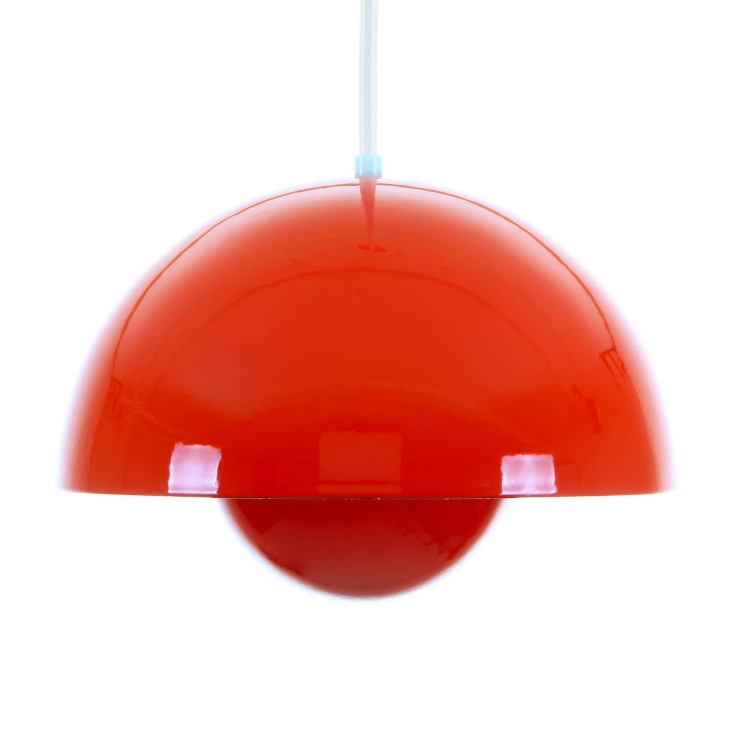Flowerpot, dark orange enameled pendant by Verner Panton in 1968 and produced by Louis Poulsen. Iconic 1960s lighting design in excellent vintage condition!

We have six pieces in stock!

Flowerpot is a stunning light, simple and organic, with an