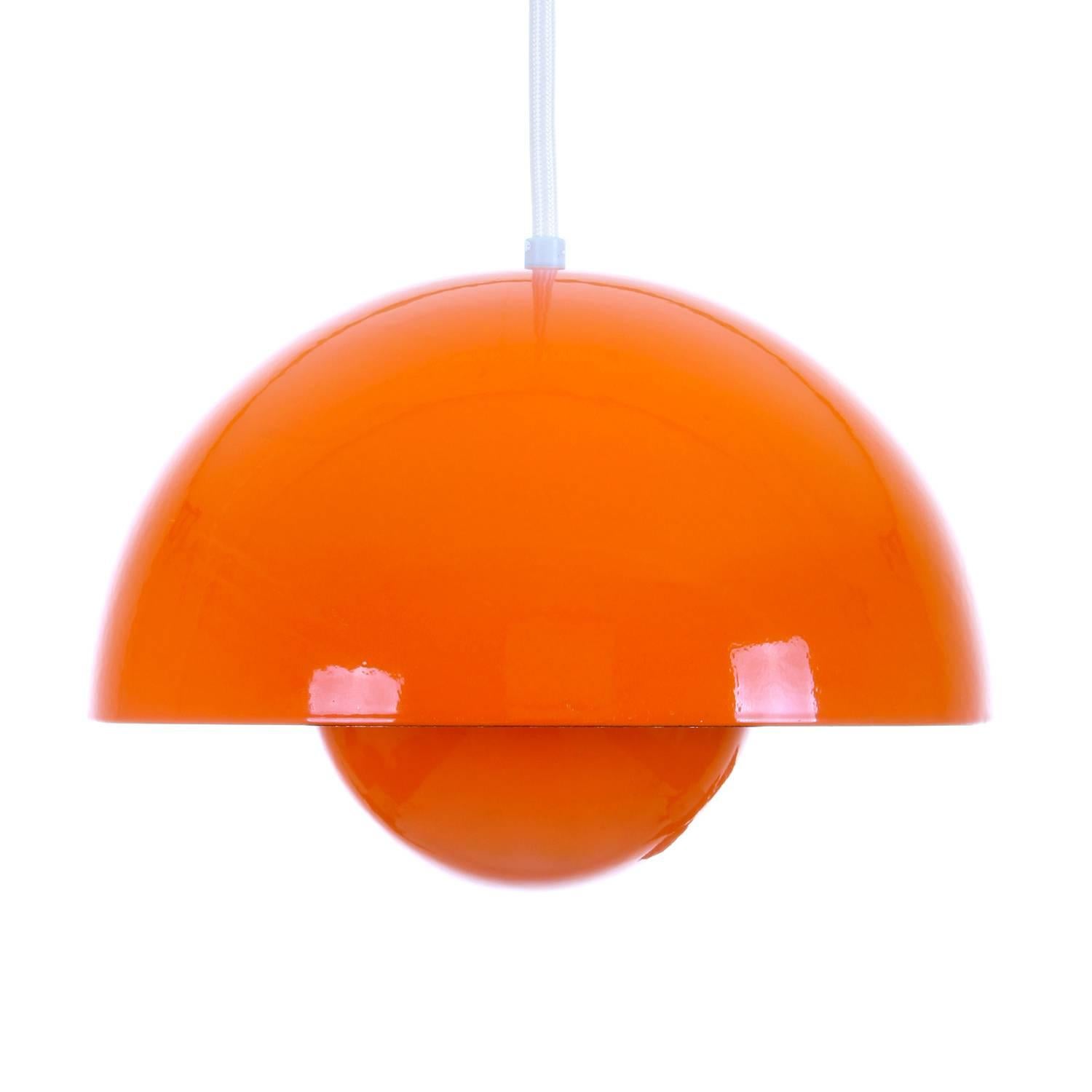 Flowerpot- orange enameled pendant by Verner Panton in 1968 and produced by Louis Poulsen. Iconic 1960's lighting design in excellent vintage condition!

We have 3 pieces left!!

Flowerpot is a stunning light, simple and organic, with an almost
