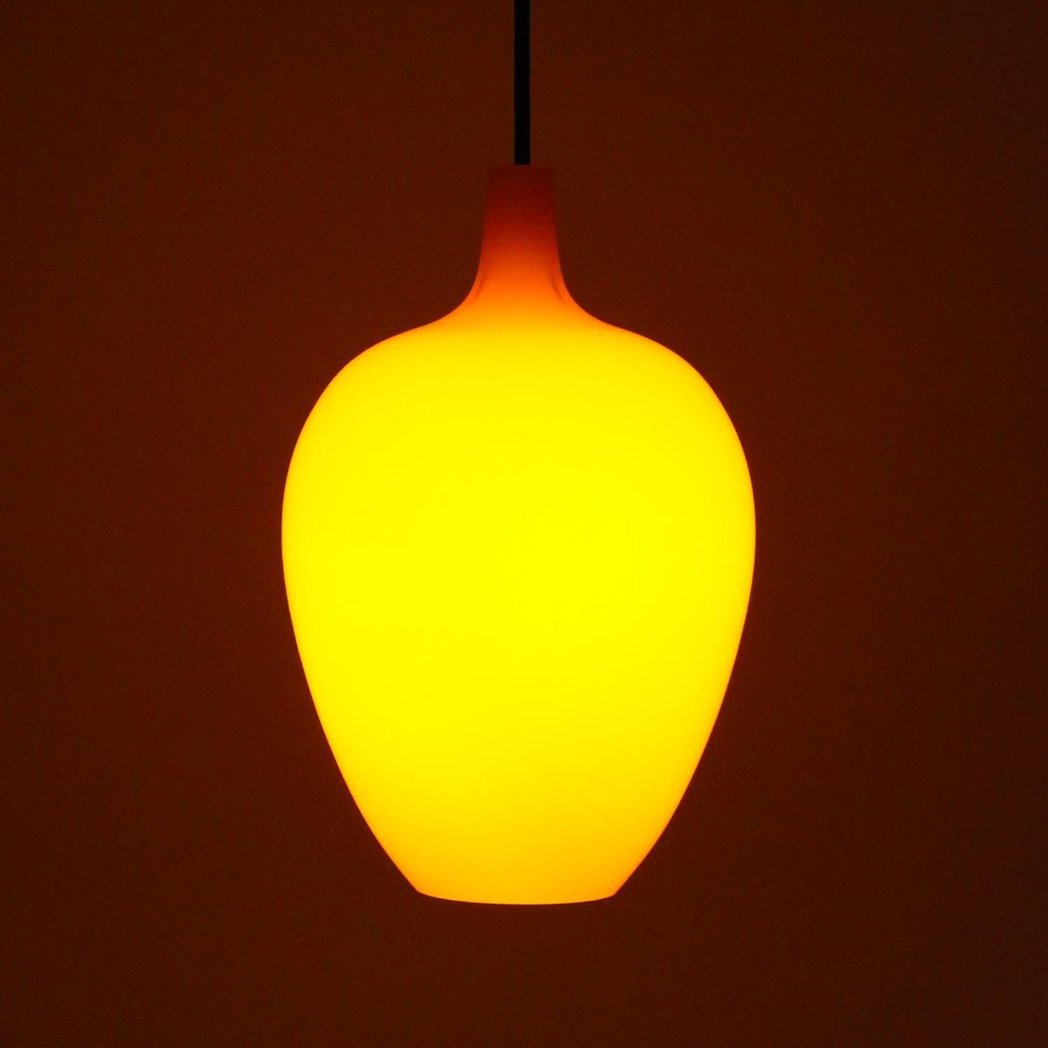 POMPEI, orange blown glass pendant light by Jo Hammerborg in 1963 and produced by Fog & Mørup in collaboration with Holmegaard Glassworks - truly amazing glass ceiling light in very good, near excellent vintage condition.

An elegantly shaped glass