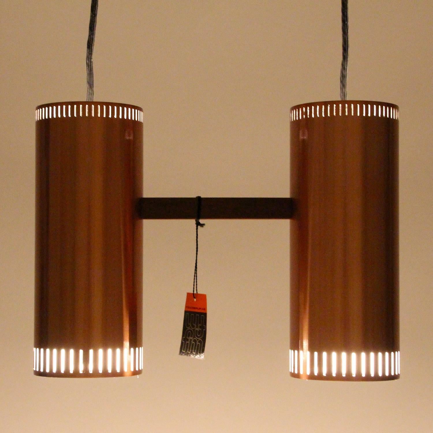 CYLINDER II, copper pendant light by Jo Hammerborg in 1966 for Fog & Mørup - Scandinavian Modern copper light fixture with two individual pendants in extremely RARE mint unused condition!

The CYLINDER II is comprised of two identical cylinder