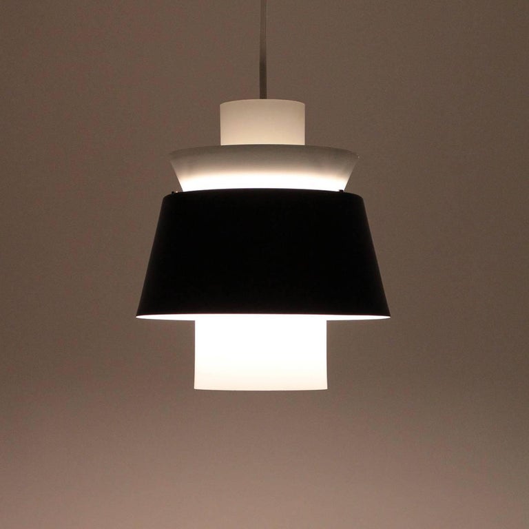 Tivoli pendant designed by Danish architect Jørn Utzon in 1947 and produced by Nordisk Solar Compagni - Very attractive white and black hanging lamp in good vintage condition!

This is a true timeless design piece, designed almost 70 years ago and