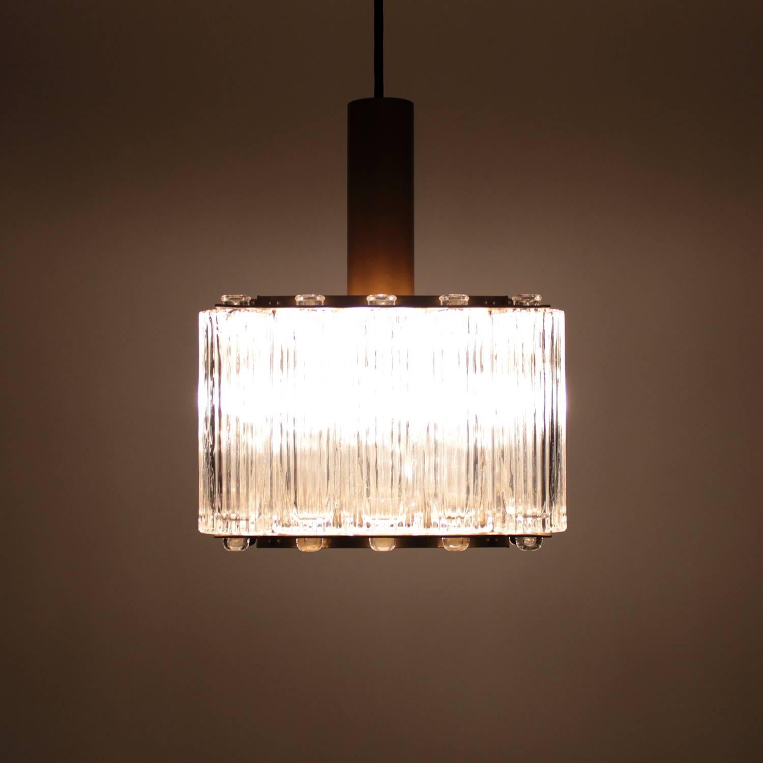 The Northern light pendant is designed by Swedish designer and manufacturer Eric Wärnå and produced by Danish Kemp Lauritzen in the 1950s, attractive square crystal light with brass frame.

A smaller sized hanging lamp, comprised of 16 individual