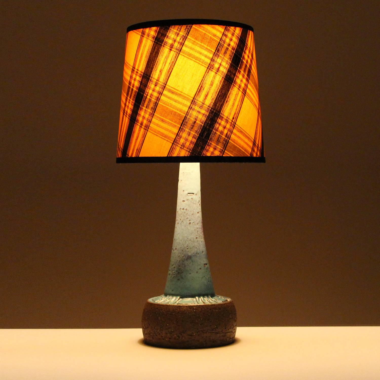 Blue Stoneware table lamp by Sejer Keramikfabrik in the 1960s - attractive lamp stand with vintage blue tartan textile shade included, in excellent vintage condition.

This alluring stoneware lamp stand features a short round body with a