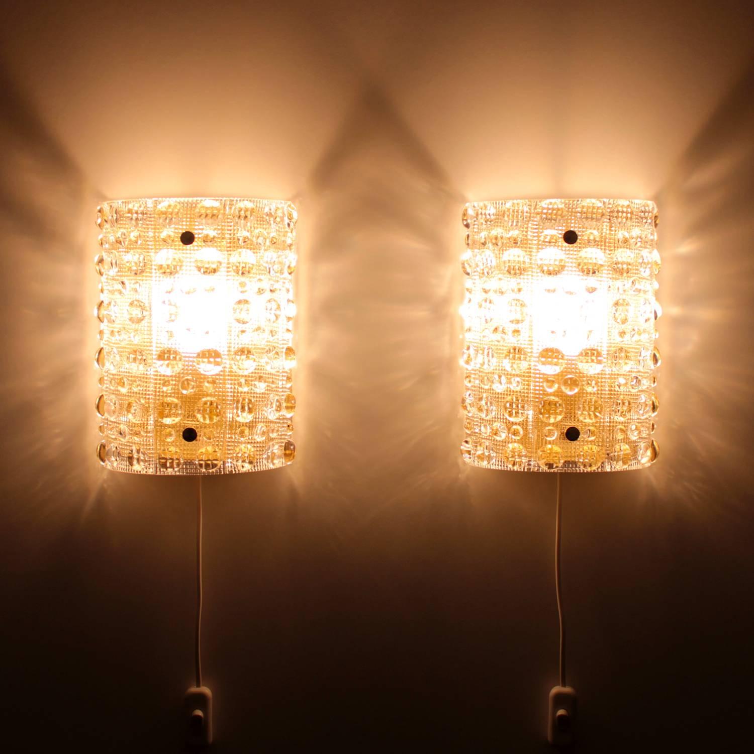 Crystal sconces, pair of wall lamps by Carl Fagerlund for Orrefors, in the late 1950s-early 1960s, absolutely gorgeous and rare pair of crystal wall lights.

A pair of magnificent crystal glass sconces that oozes Swedish glass design at its best,