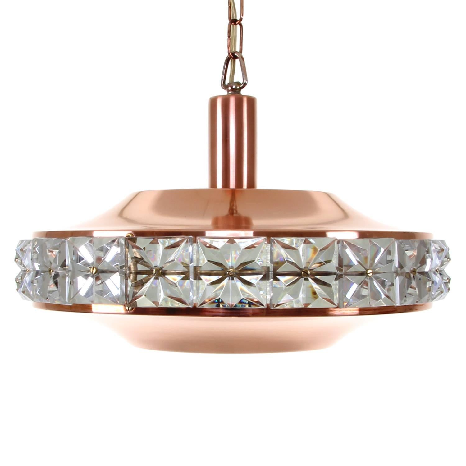 Copper and crystal pendant, produced by Danish Vitrika in the 1960s, gorgeous polished copper hanging light with crystal glass and crystal inner shade in good vintage condition!

A beautiful copper pendant comprised of two polished copper shades