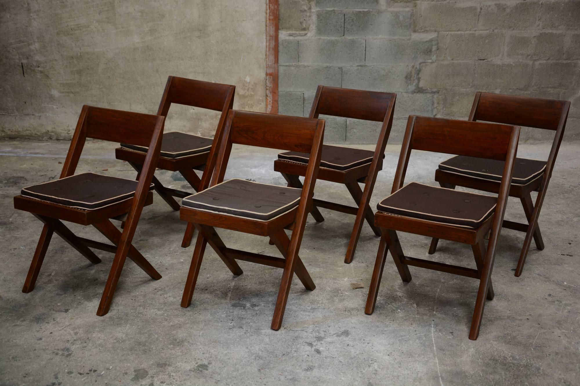 Pierre Jeanneret, unique set of six library chairs for the Court Building and the University Library in Chandigarh, India. Teak, woven cane. Two chairs are with original lettering (see photos). These chairs were handmade, dimensions can vary