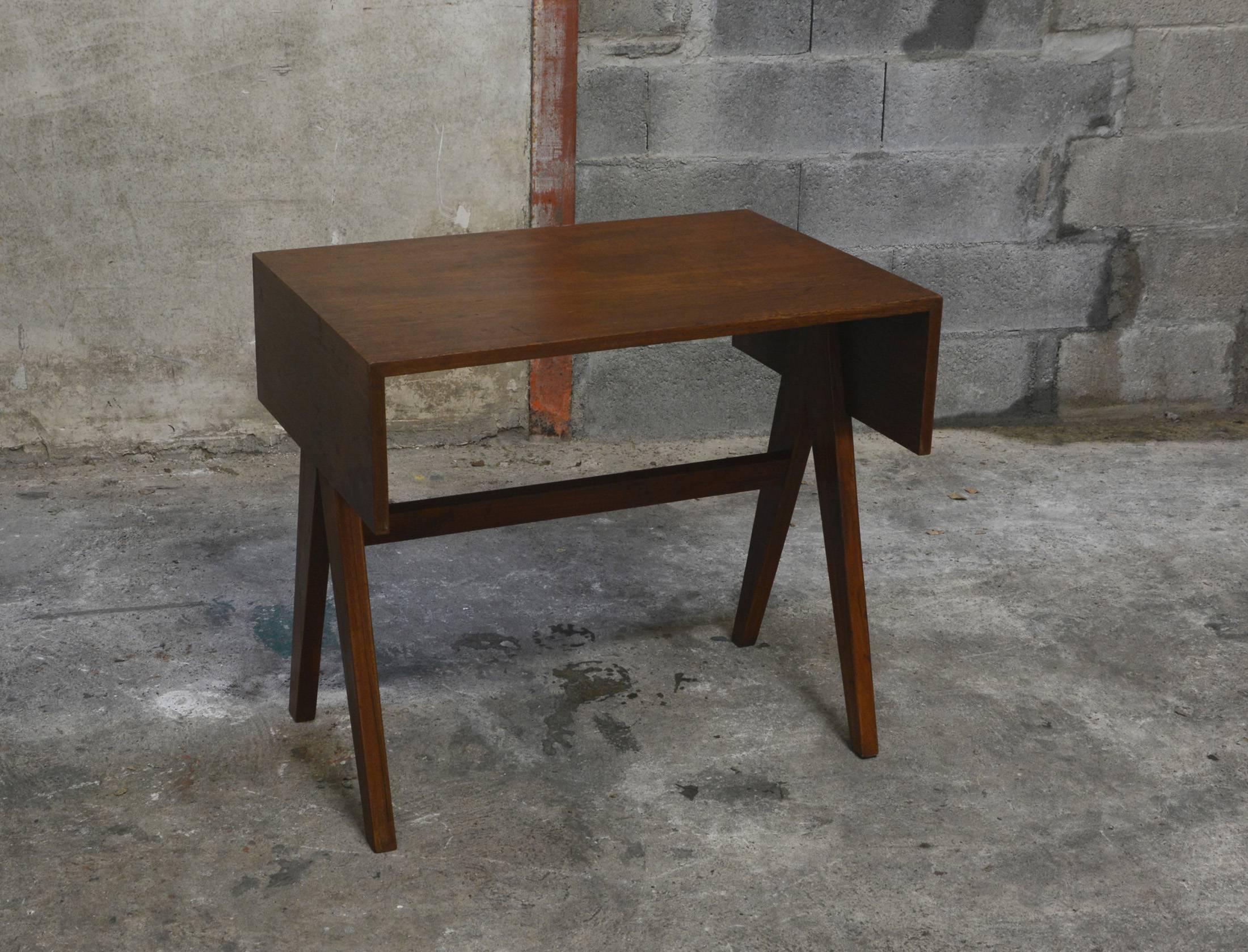 Pierre Jeanneret, student desk for the college of architecture in Chandigarh, India
Solid teak, V-shaped legs.
See photo before restoration when we bought it in Chandigarh (we are one of the few to propose these photos).
Possibility to sell it