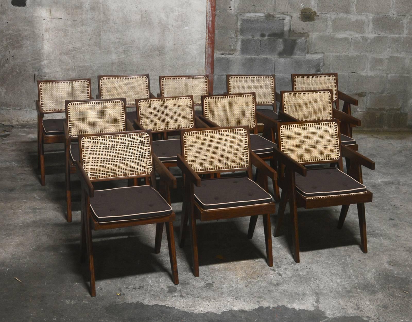 Pierre Jeanneret, very rare set of 12 cane and teak wood office armchairs from administrative buildings in Chandigarh, India. Back attached to the seat. Teak, woven cane and upholstered seat cushion featuring cloth covering. See photo before