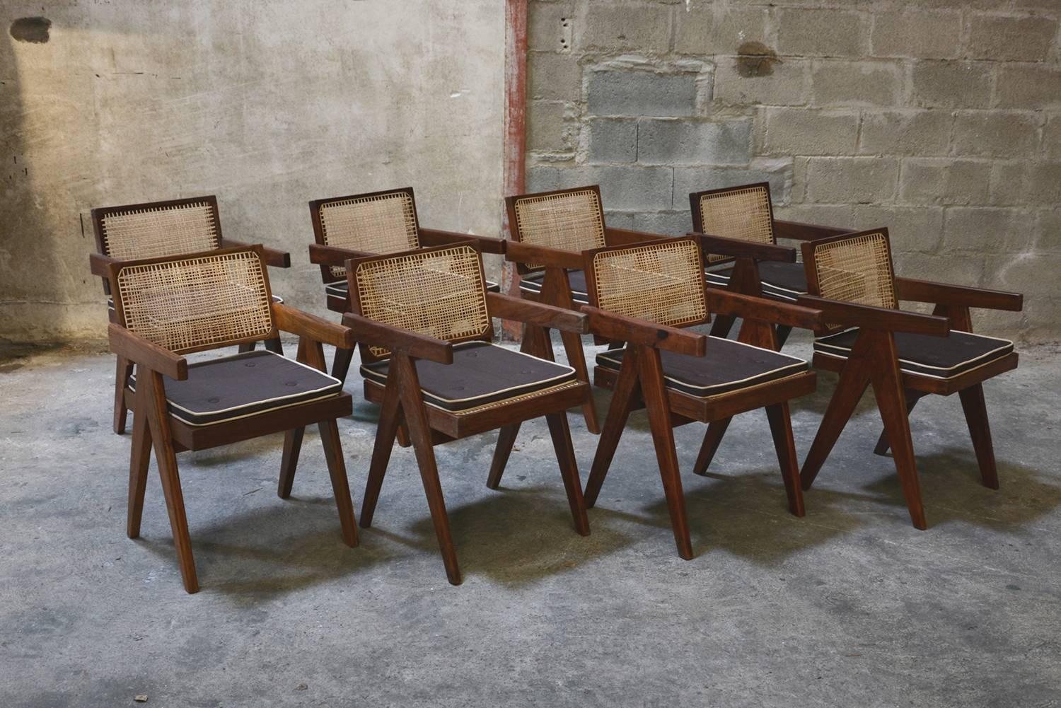 Pierre Jeanneret, very rare set of eight cane and teakwood office armchairs from administrative buildings in Chandigarh, India. Version with back separated from the seat. Teak, woven cane and upholstered seat cushion featuring cloth covering. See