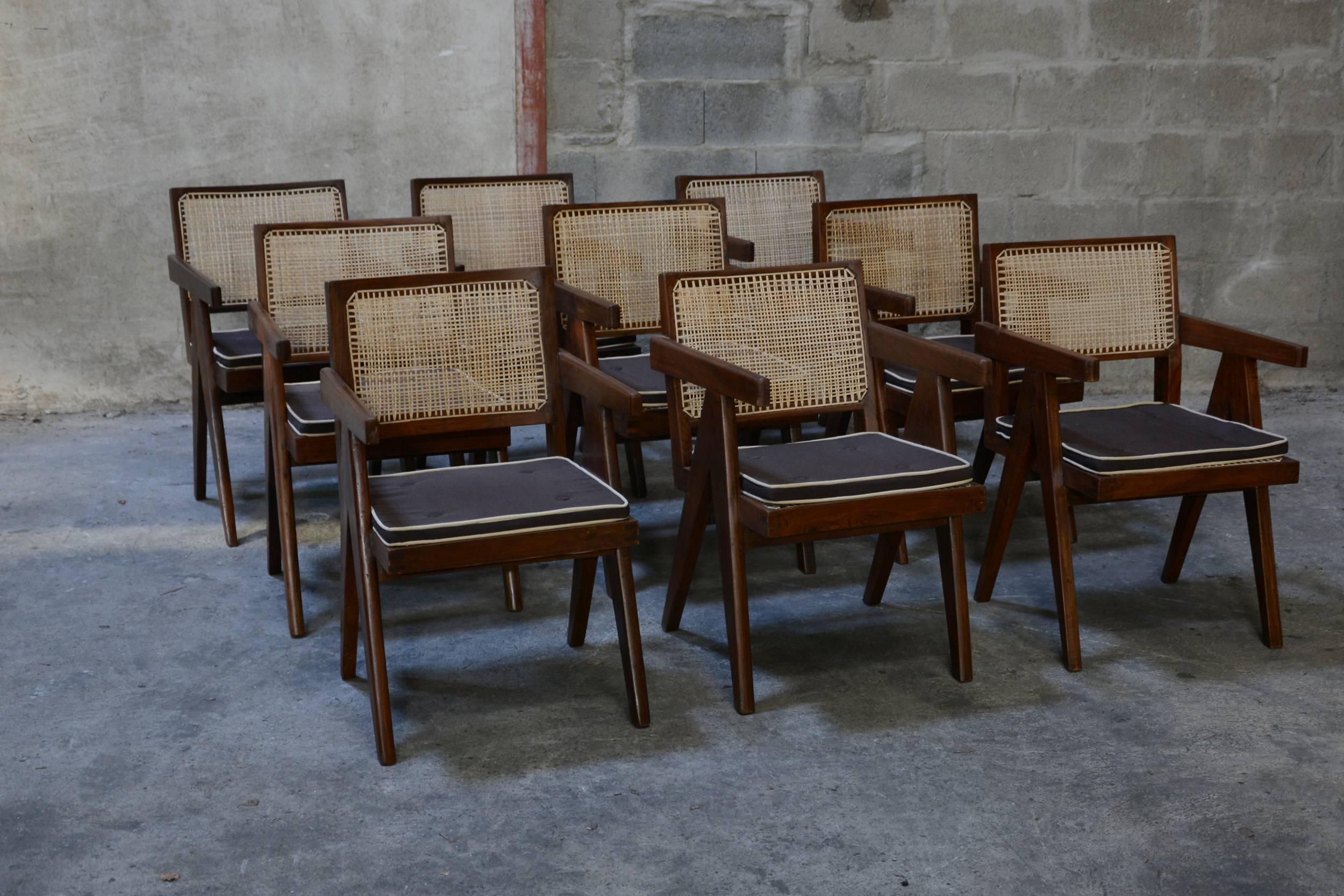 Pierre Jeanneret, very rare set of nine cane and teak wood office armchairs from administrative buildings in Chandigarh, India. Version with back jointed to the seat by large spindle pieces. Teak, woven cane and upholstered seat cushion featuring