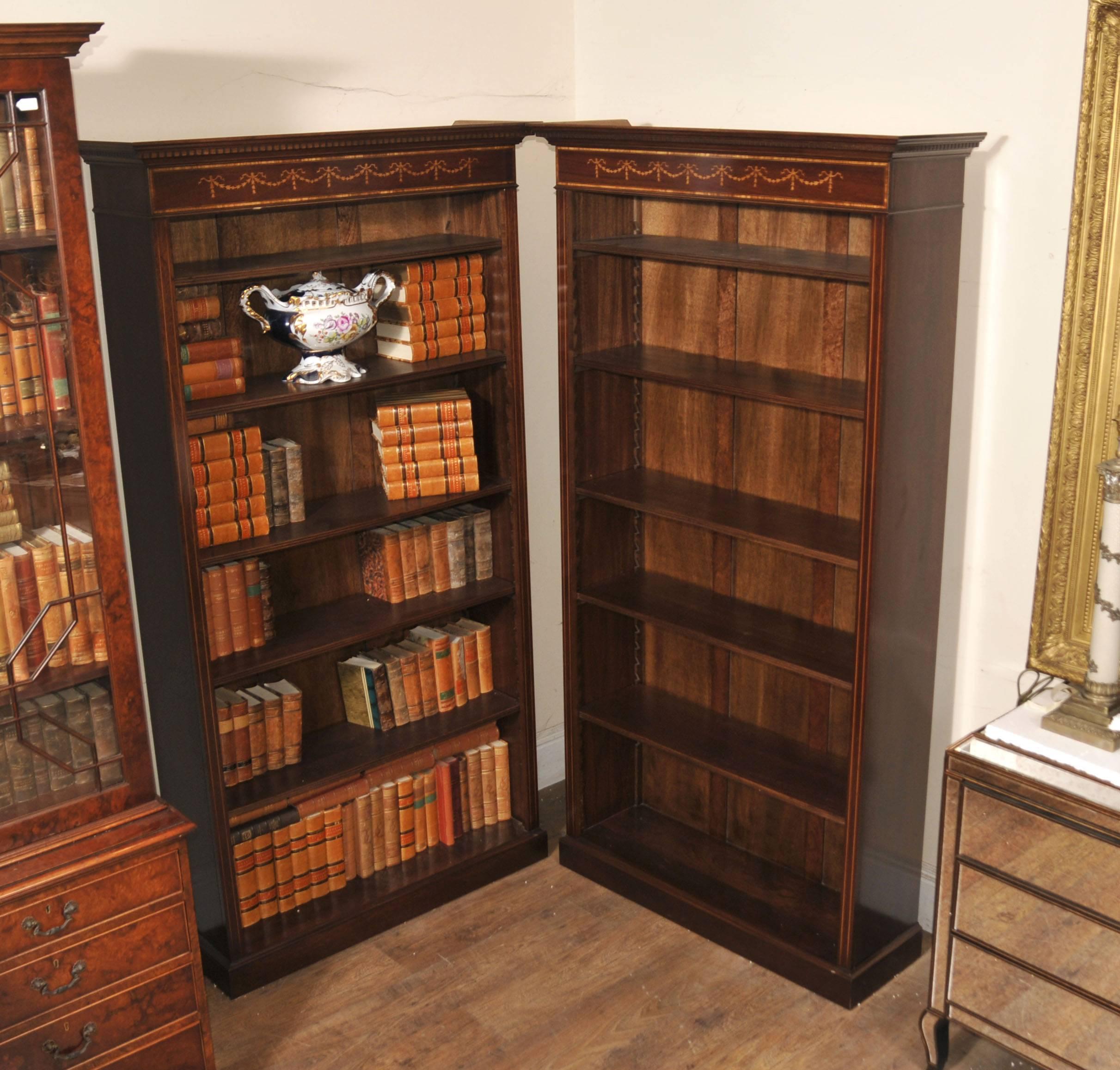 You are looking at a pair of English Sheraton style open front bookcases hand crafted from the finest mahogany. This lovely pair are the perfect mix of decorative beauty and practical functionality to make for a vintage design classic. They look