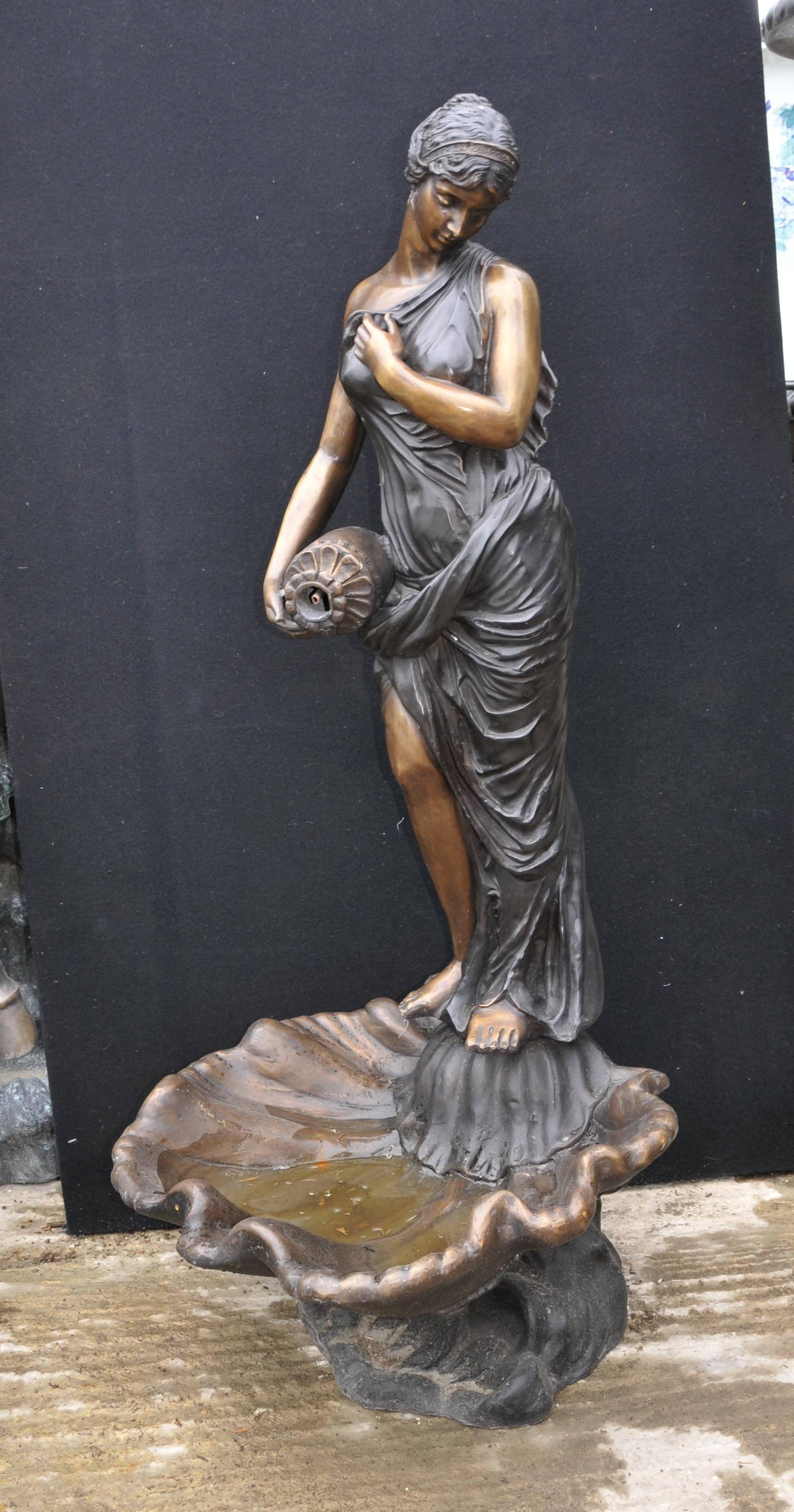 Gorgeous lifesize Italian bronze casting of a maiden holding an Amphora urn as fountain.
Water spills into the large conch shell at the bottom.
At over 5 feet tall great size to this piece which is of an architectural importance.
Patina to the