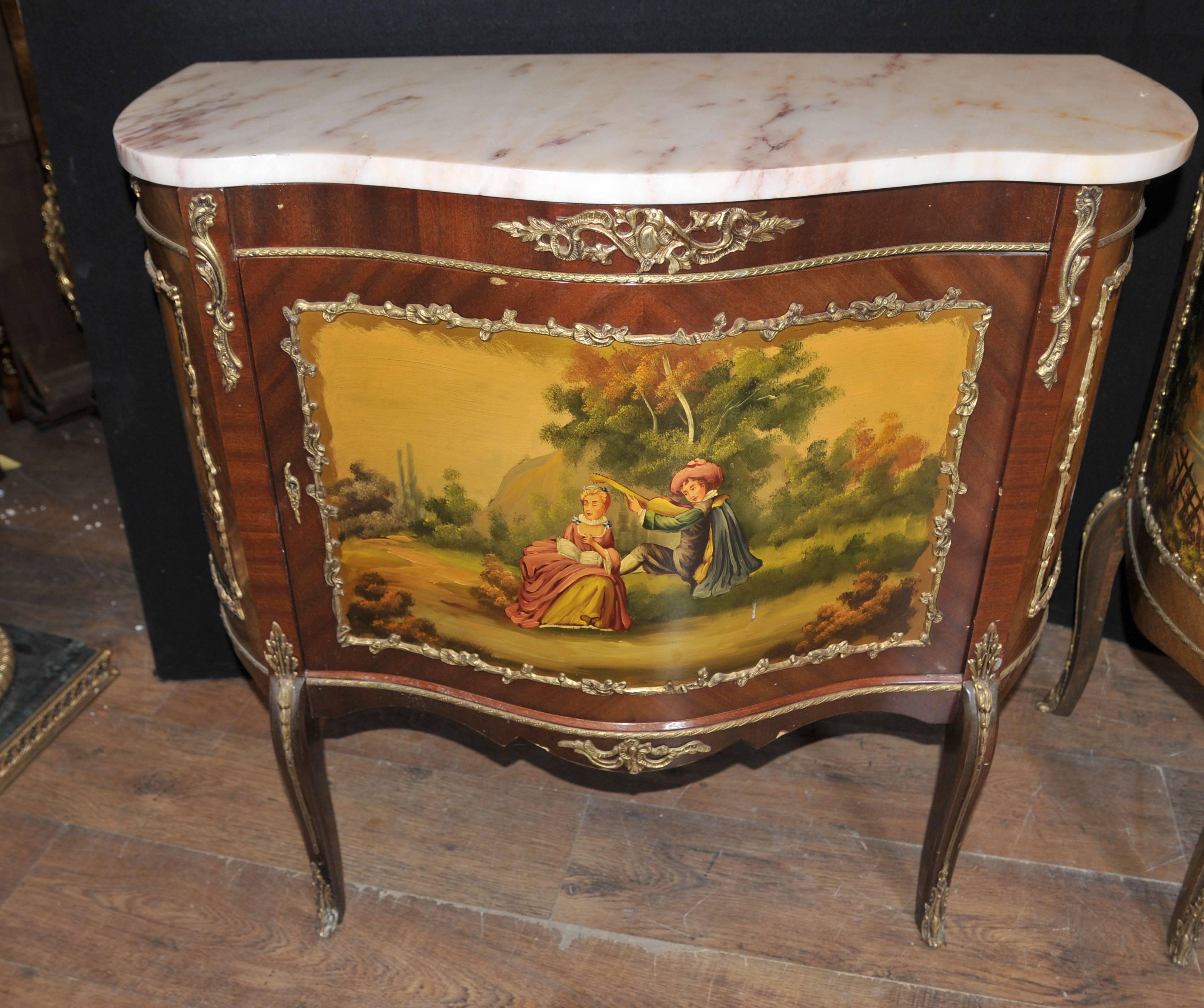 Gorgeous pair of French antique Vernis Martin style painted cabinets.
In French interior design, Vernis Martin is a type of imitation lacquer named after the French brothers. Guillaume and Etienne-Simon Martin.
Painted panels show lovely scenes of