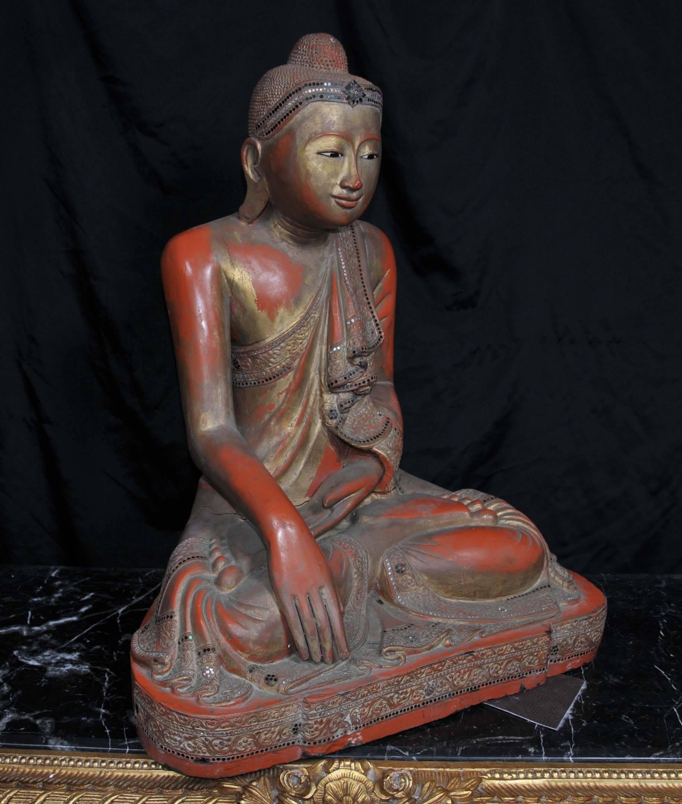 Burmese red lacquered seated figure of Buddha, late 20th century
Add serenity and compassion to any interior with this fab piece.
Classic lotus pose of the statue with elongated hands.
Wood has a red finish with gold tints.
Bought from a dealer