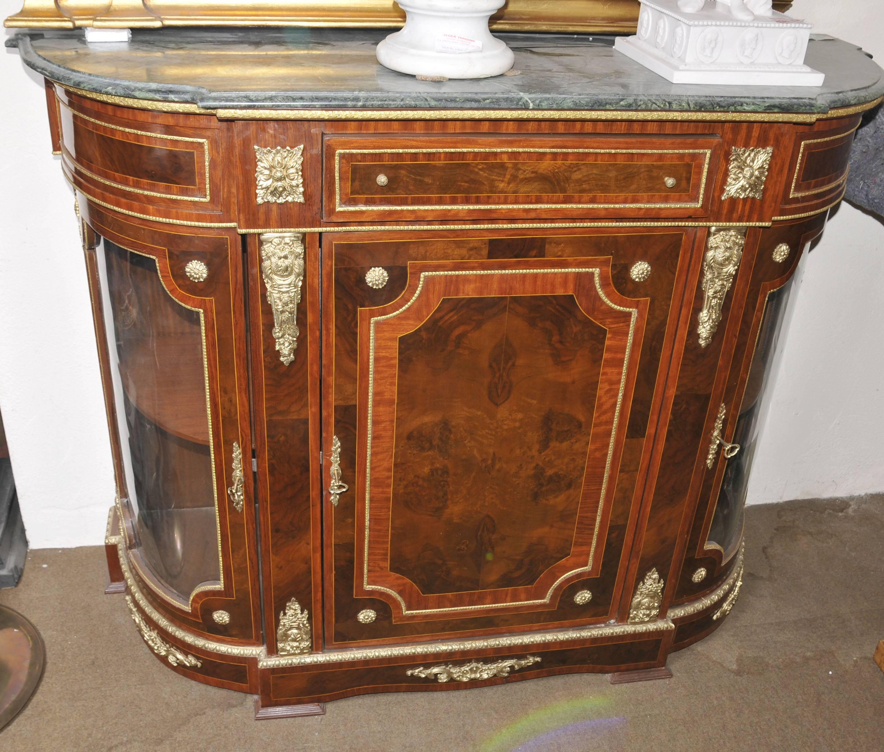 Stunning French Empire sideboard or cabinet in kingwood.
Elegant piece with lots of internal storage and glass fronted sides.
Ormolu fixtures are well cast and very bright.
Bought from a dealer at Les Puces flea market in Paris.
Offered in great