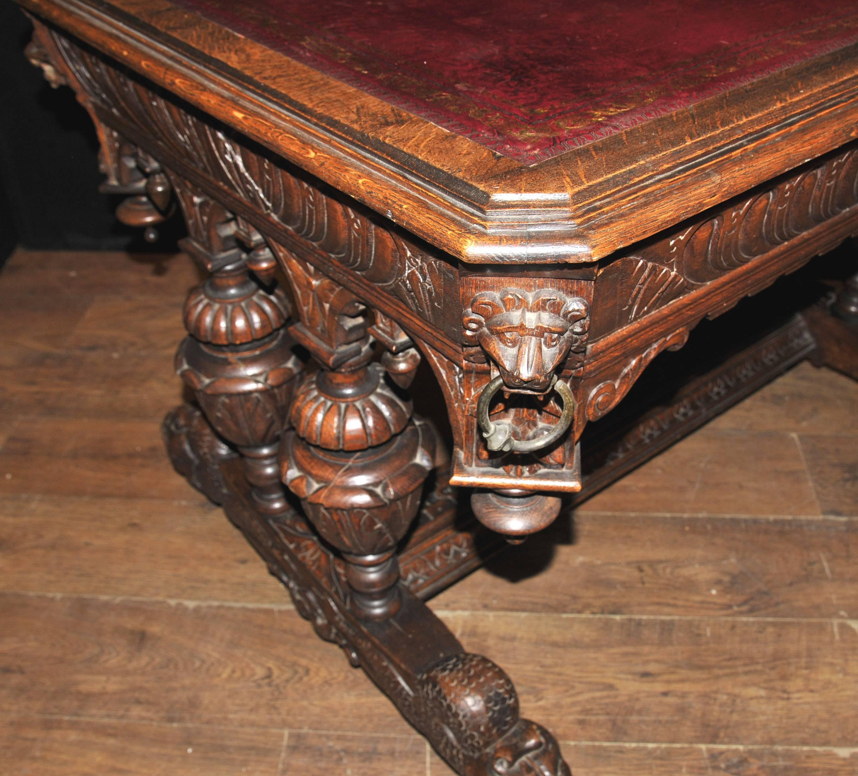 Stunning antique 19th century carved oak library table which would also function as a great desk.
Intricately hand carved the details are exquisite with lions head handles, urn legs, sea serpent legs and other intricate motifs and designs.
Really