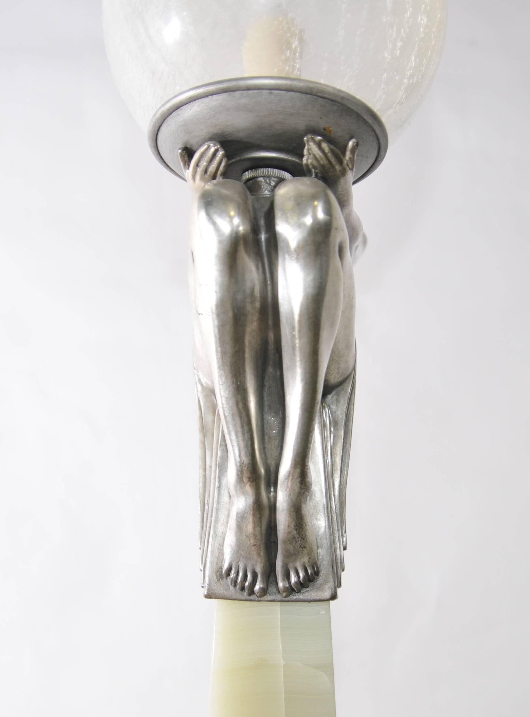 This is based in our Los Angeles showroom, please get in touch for a shipping quote.
This piece somehow manages to sum up all that is wonderful about the 1920s.
Classic biba girl sat on the marble obelisk holding aloft the glass orb