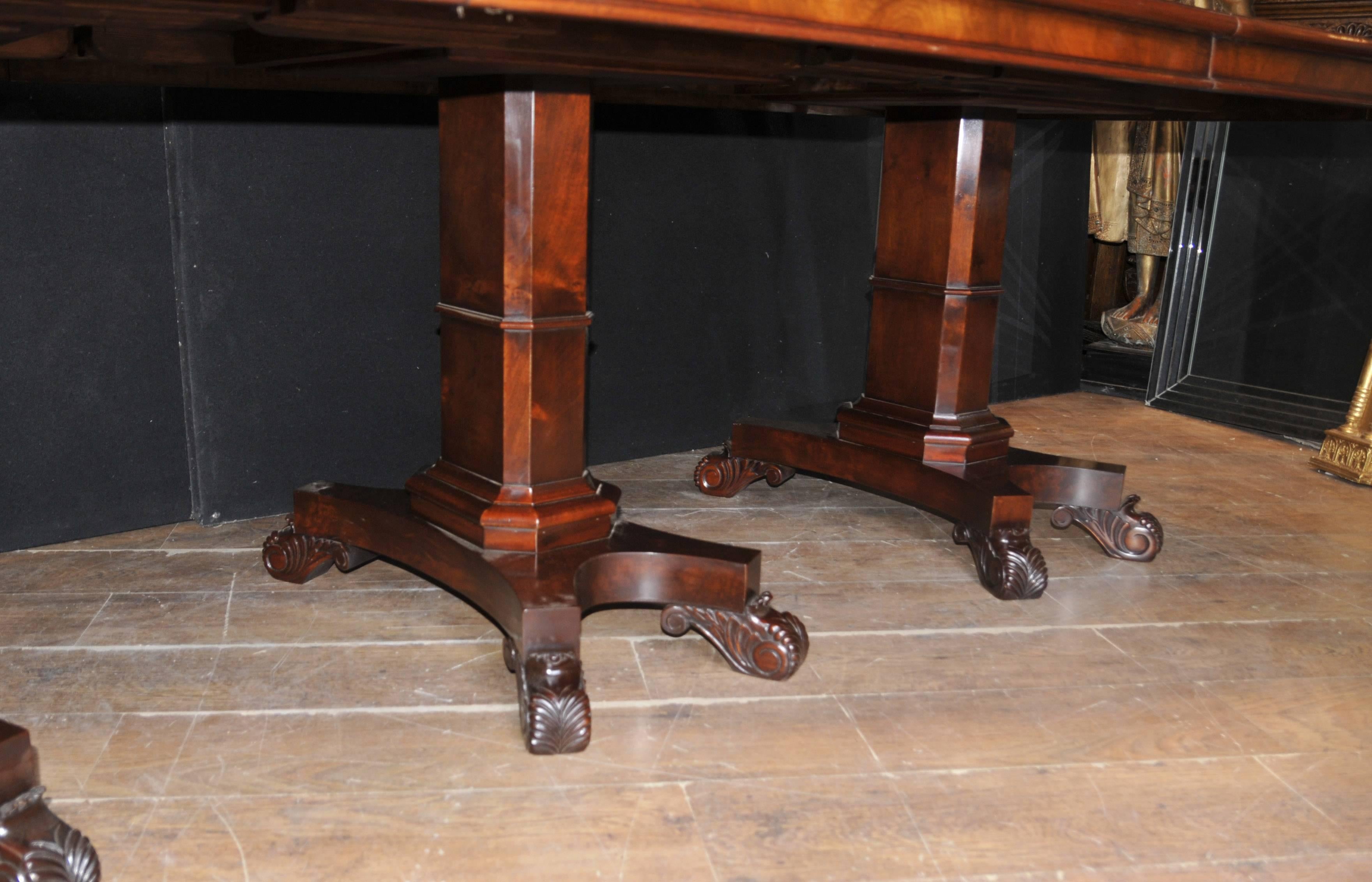 Sumptuous Regency style dining table in mahogany in the style of George Bullock.
Triple pedestal dining table which extends to 12 feet (365 cm) with the two extra leaves in.
Hence there are various different size combinations with the two leaves