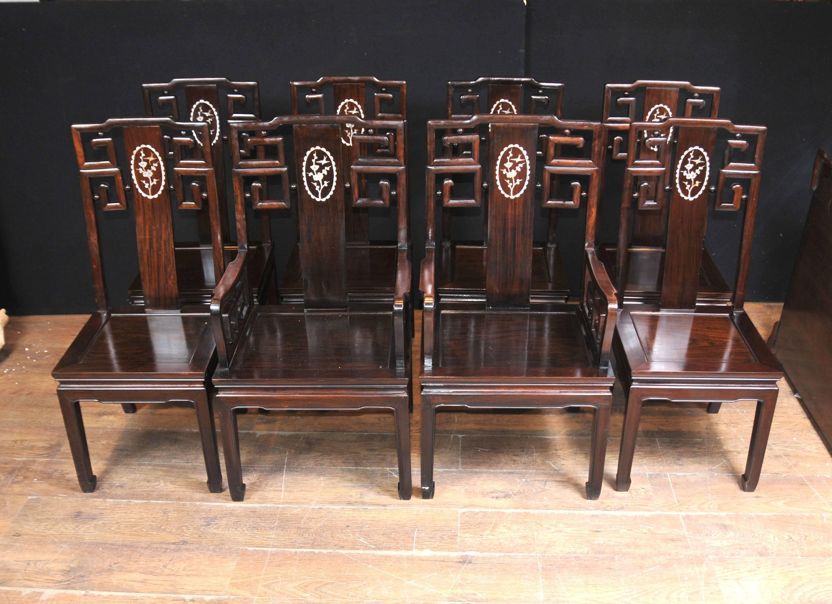 Gorgeous antique Chinese hardwood dining set consisting of a table and eight matching chairs.
Handcrafted from hardwood which is very solid and sturdy.
Hand-carved details include intricate apron to table, very florid and skilled in