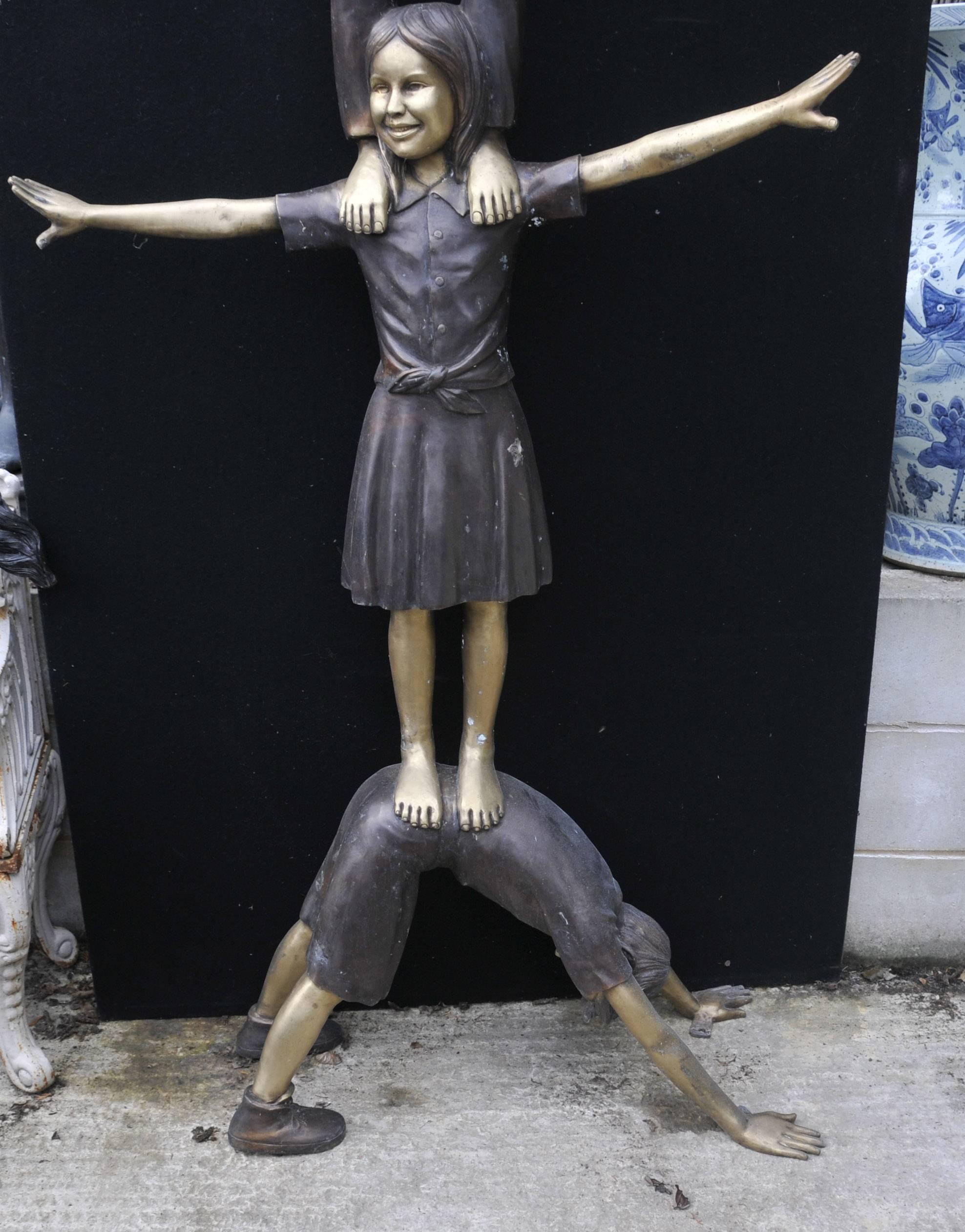 Amazing lifesize bronze statue of three kids doing acrobatics.
Of course being bronze this can live outside with no fear of rusting so great piece for the garden or lawn.
Stands in at over seven feet tall so great size to this piece - 220
