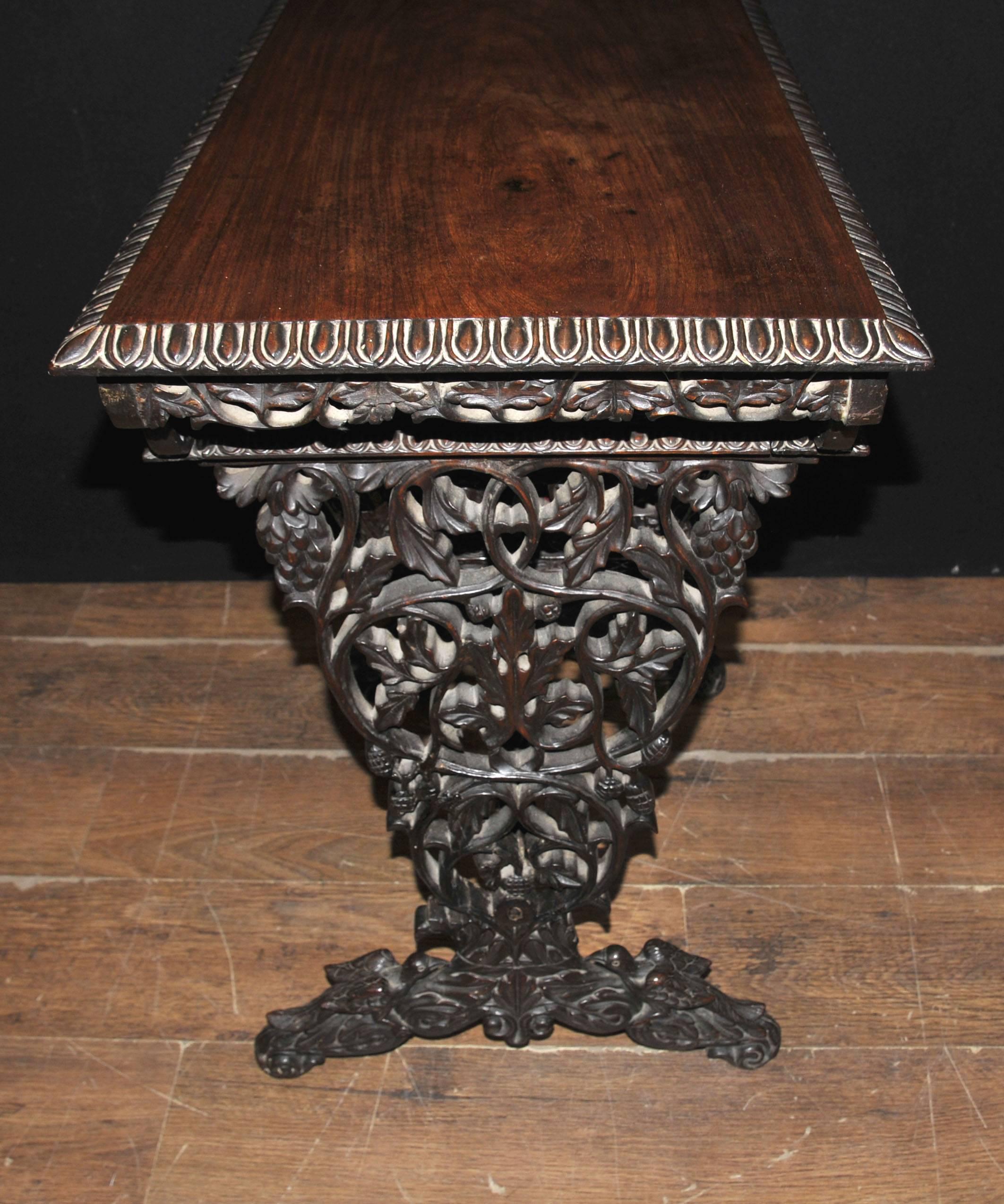 Amazing hand-carved antique Burmese writing table or desk.
Hopefully the photos illustrate the amazingly detailed hand-carved features.
Typical of Burmese furniture, carved from hardwood.
Large drawer opens out below to reveal lots of additional