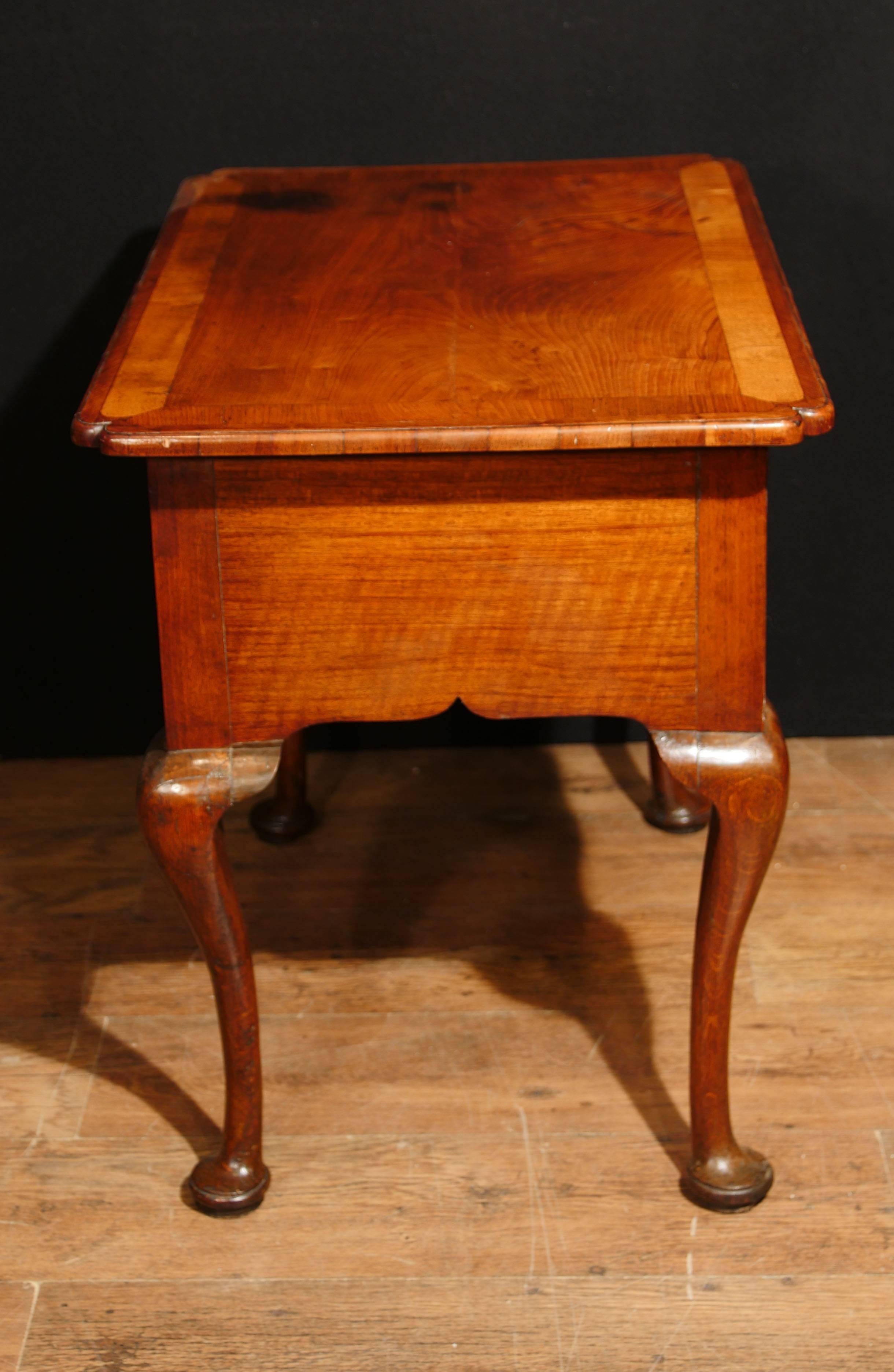 Stunning antique Queen Anne low boy in walnut.
We date this collectors piec to circa 1710.
Classic clean Queen Anne design with pad feet. 
Acts also as a lovely hall or console table.
Three drawers to front so ample storage.
Offered in great