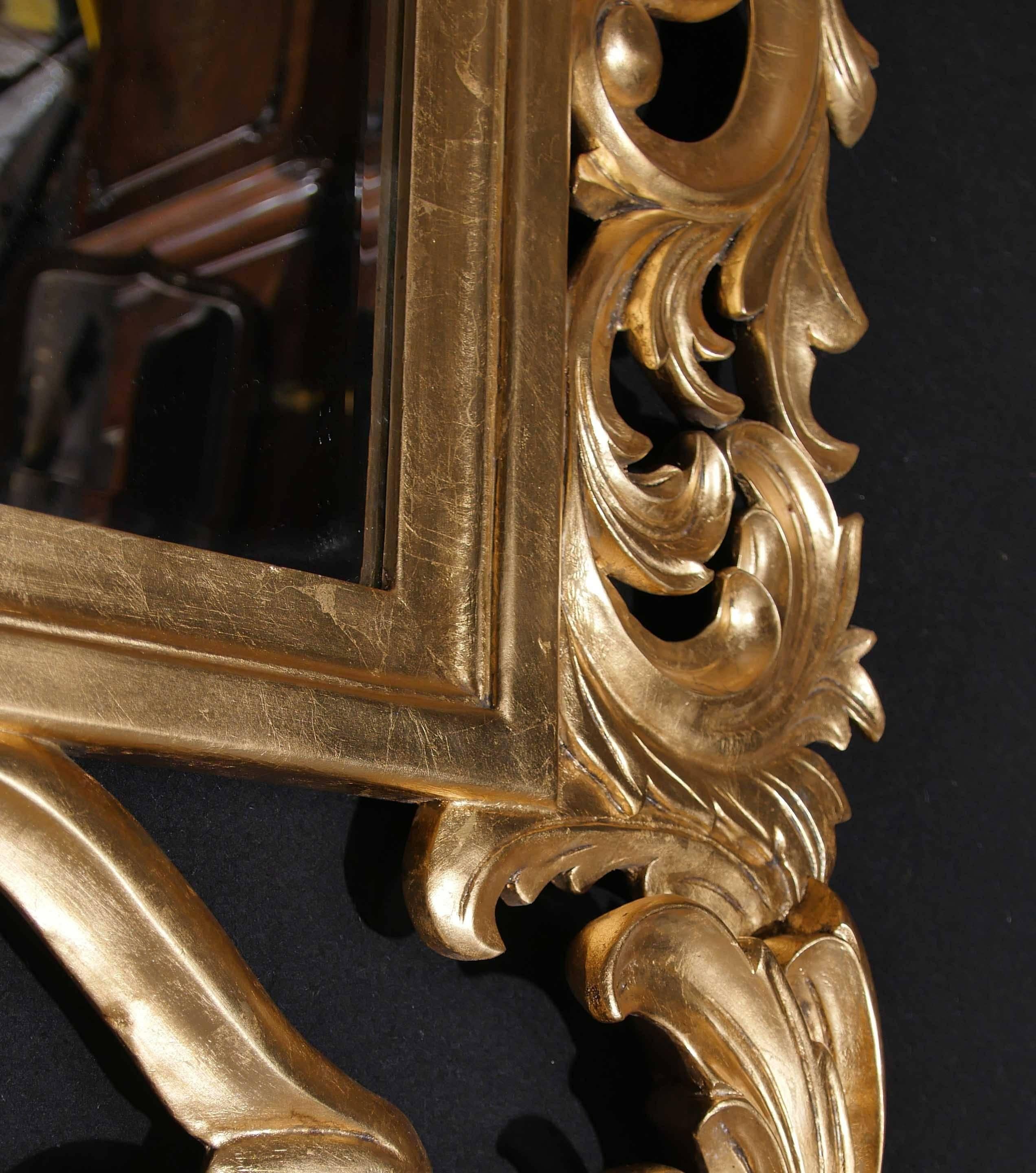 -Stunning French Rococo giltwood pier or wall mirror.
- Great look to this elegant piece, florid floral and leaf motifs in Classic Rococo style.
- Glass is clear and blemish free and beveled at edges.
- Offered in great condition, ready for home