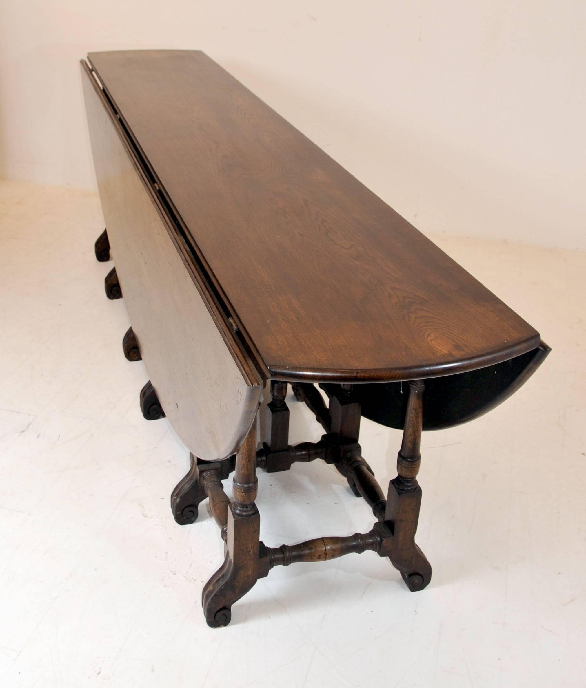 Gorgeous English wakes table in oak.
Measures over eight feet long so great size to this table.
When open with both folding leaves set up nice large oval shape.
The term 'wakes' table comes from the fact these tables would have been used at a