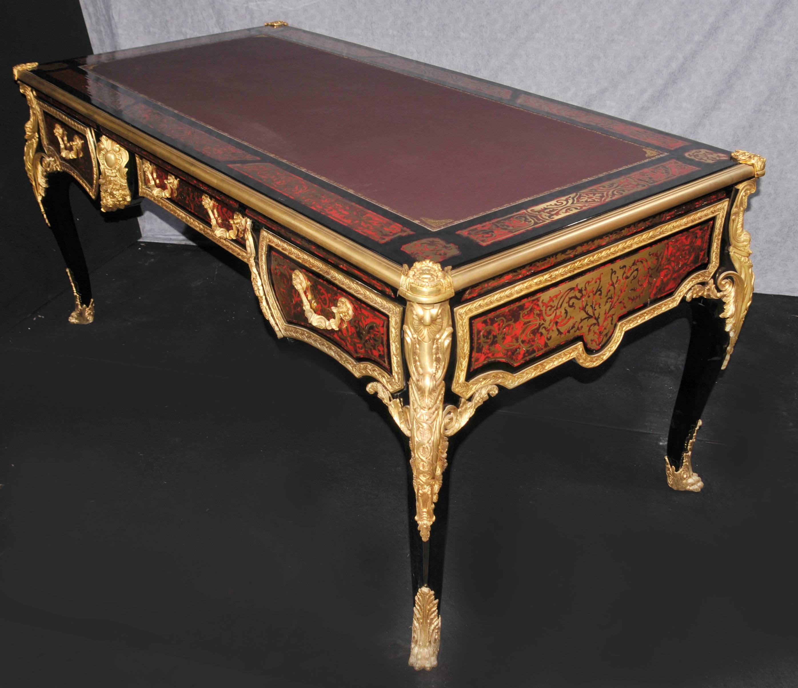 Absolutely stunning French Boulle style desk or bureau plat.
One of the things that attracted us to this desk was it's big size six feet wide.
Charles Andre Boulle was renowned for his trademark style of inlay using brass overlaid over the ebony