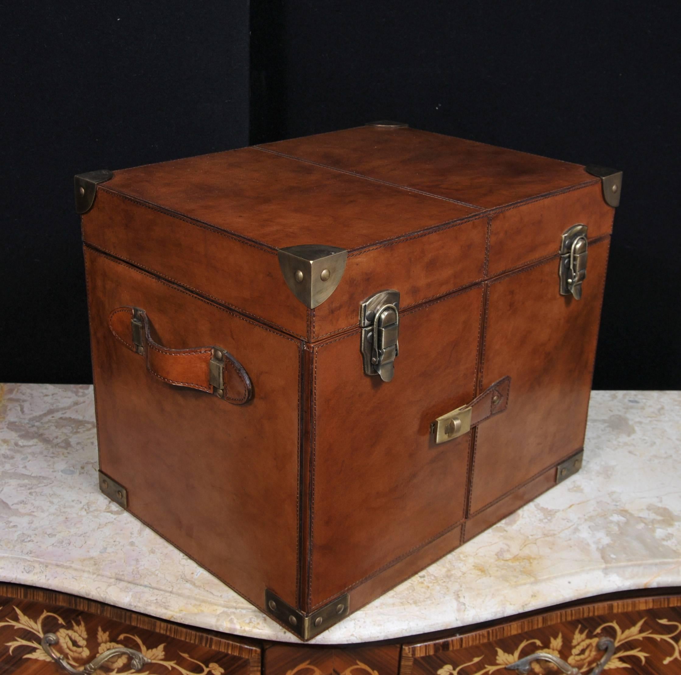 What a delight - gorgeous hamper and wine box perfect for glorious Goodwood or Glyndebourne (or any events on the summer season).
Leather trunk has that trendy campaign furniture look with burnished metal corner protectors and straps.
Top opens