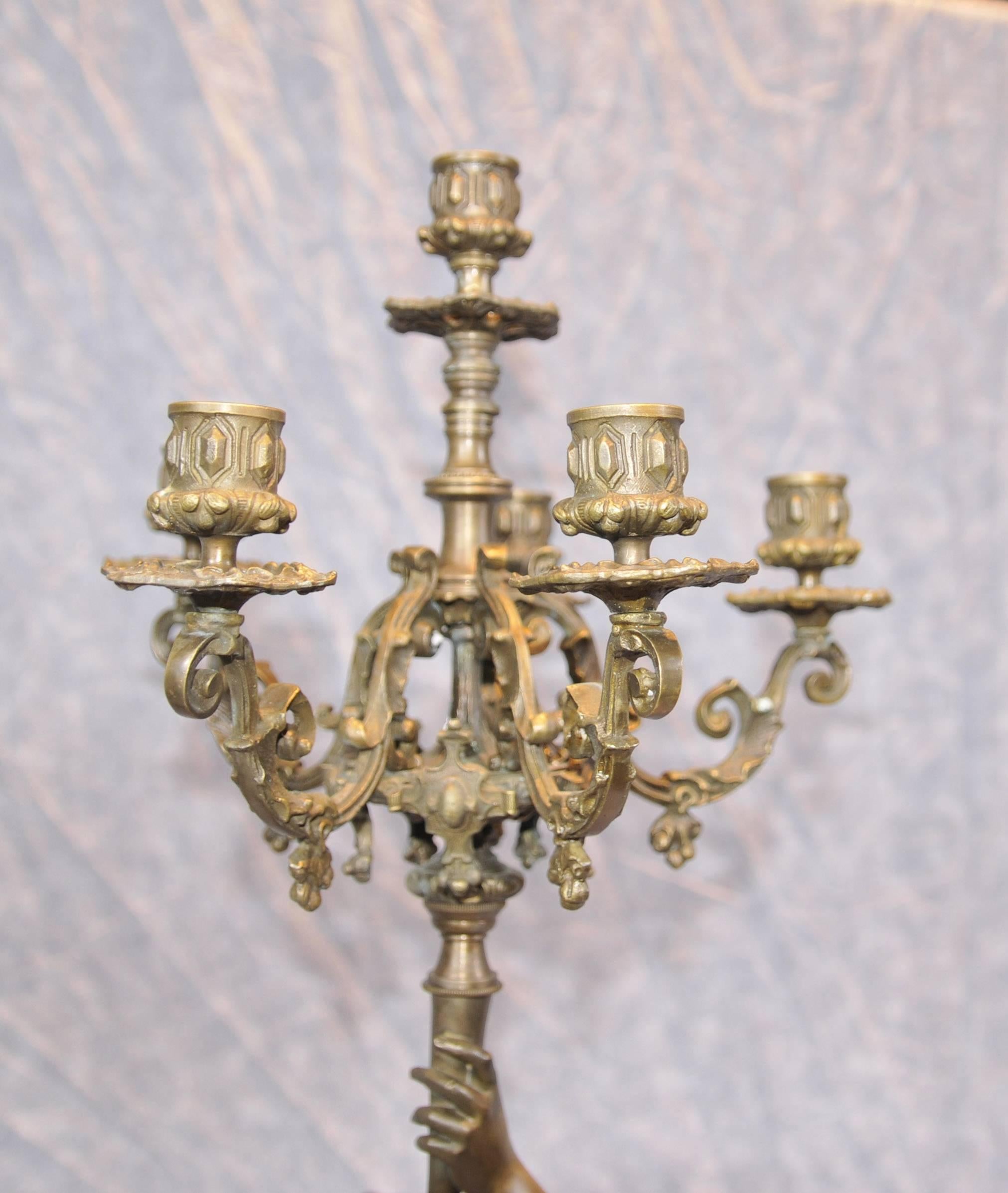 Absolutely stunning pair of French Bronze candelabras signed  Gregoire
These are later castings from the original
Each figurine holds aloft the five branch candelabras
Casting is superb and the patina to the bronze is wonderful
Each Stand in at over